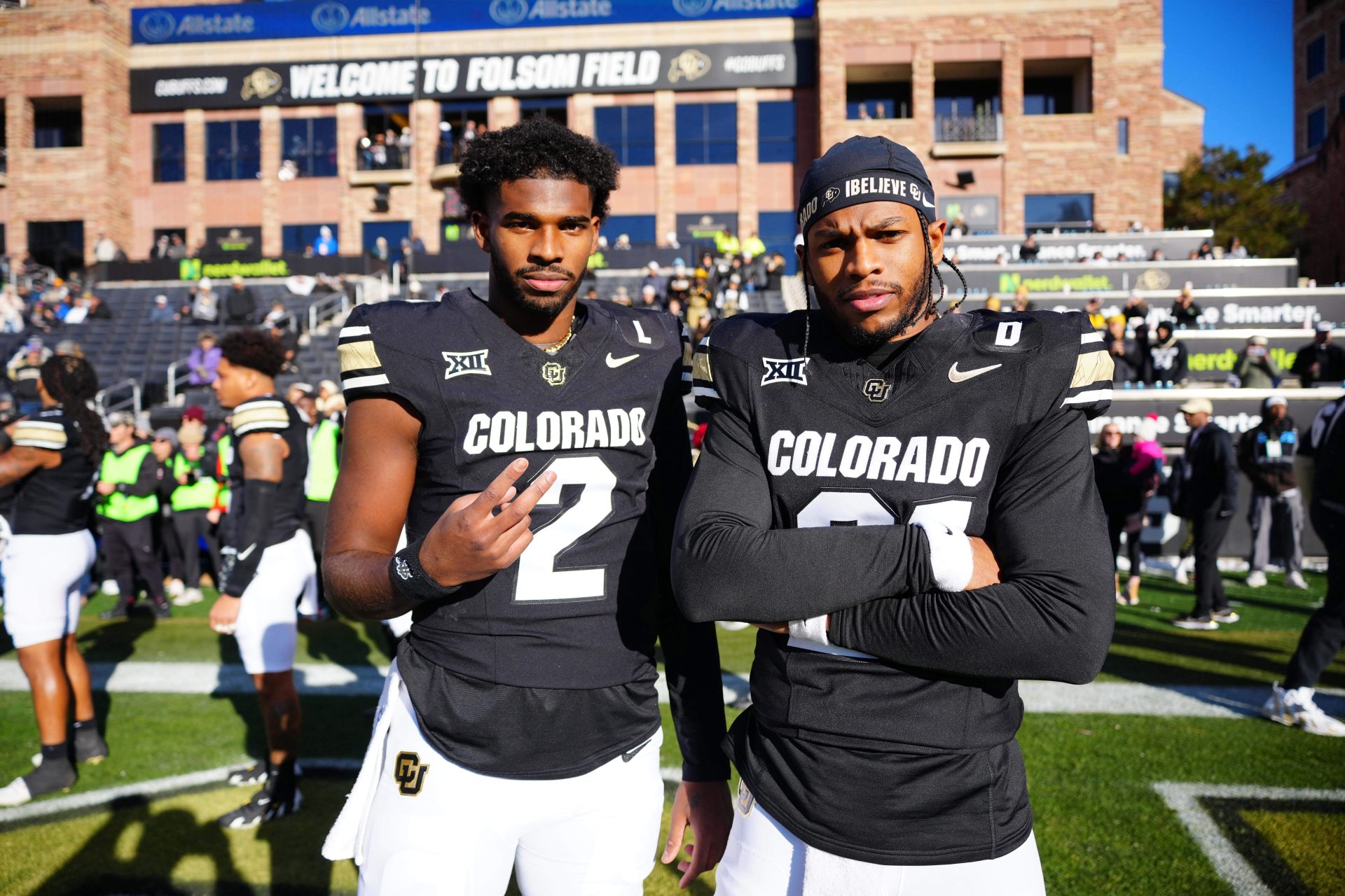 Colorado Buffaloes quarterback Shedeur Sanders (2) and safety Shilo Sanders (21) pose for a photo before the game against the Oklahoma State Cowboys at Folsom Field.