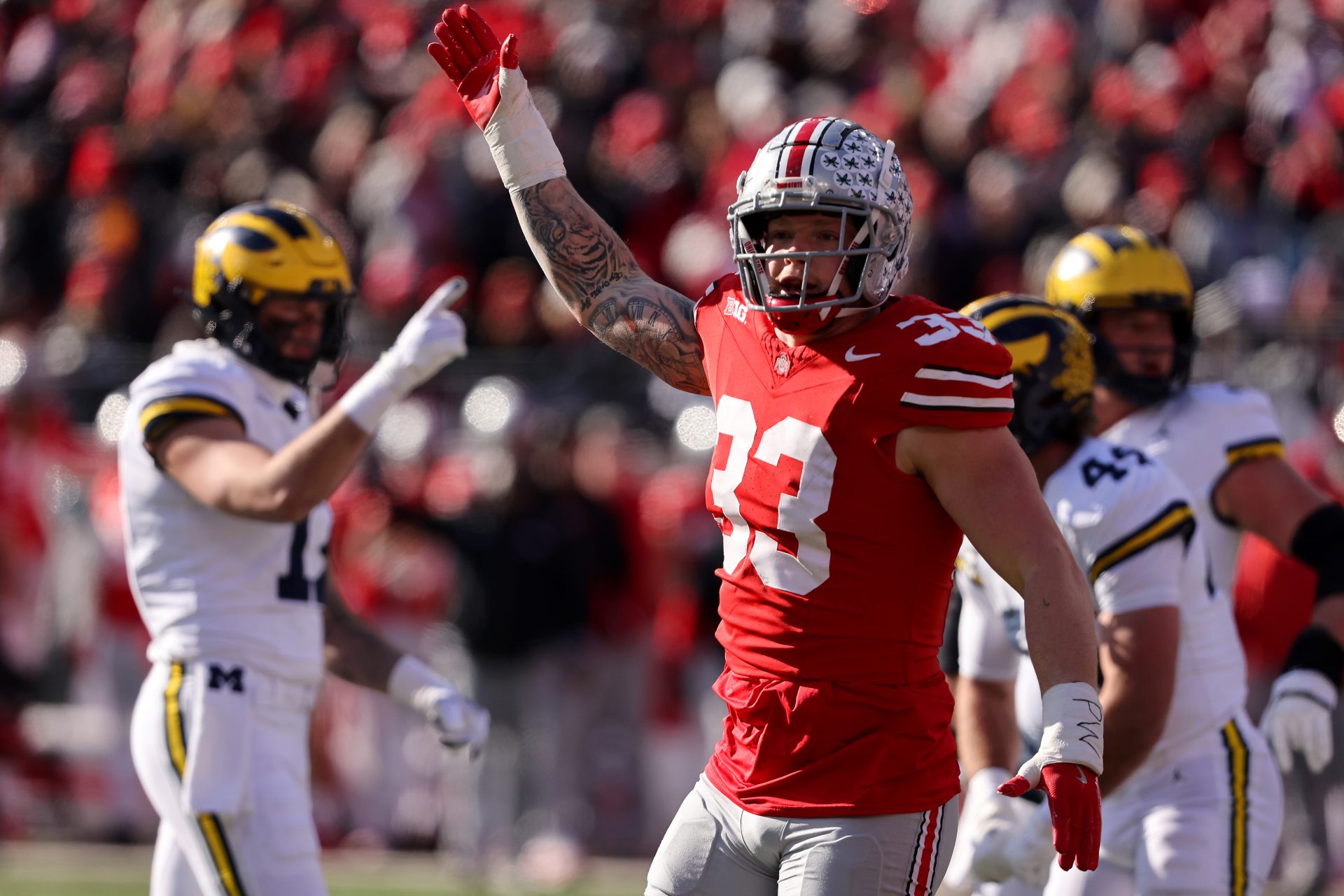 Ohio State Buckeyes defensive end Jack Sawyer (33)celebrates a fourth down stop during the first quarter against the Michigan Wolverines at Ohio Stadium.