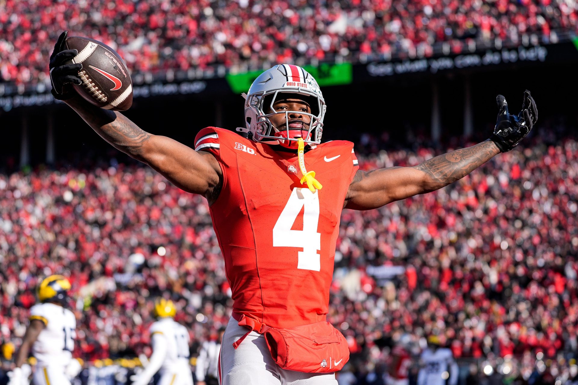 Ohio State wide receiver Jeremiah Smith (4) celebrates a touchdown against Michigan during the first half at Ohio Stadium in Columbus, Ohio on Saturday, Nov. 30, 2024.