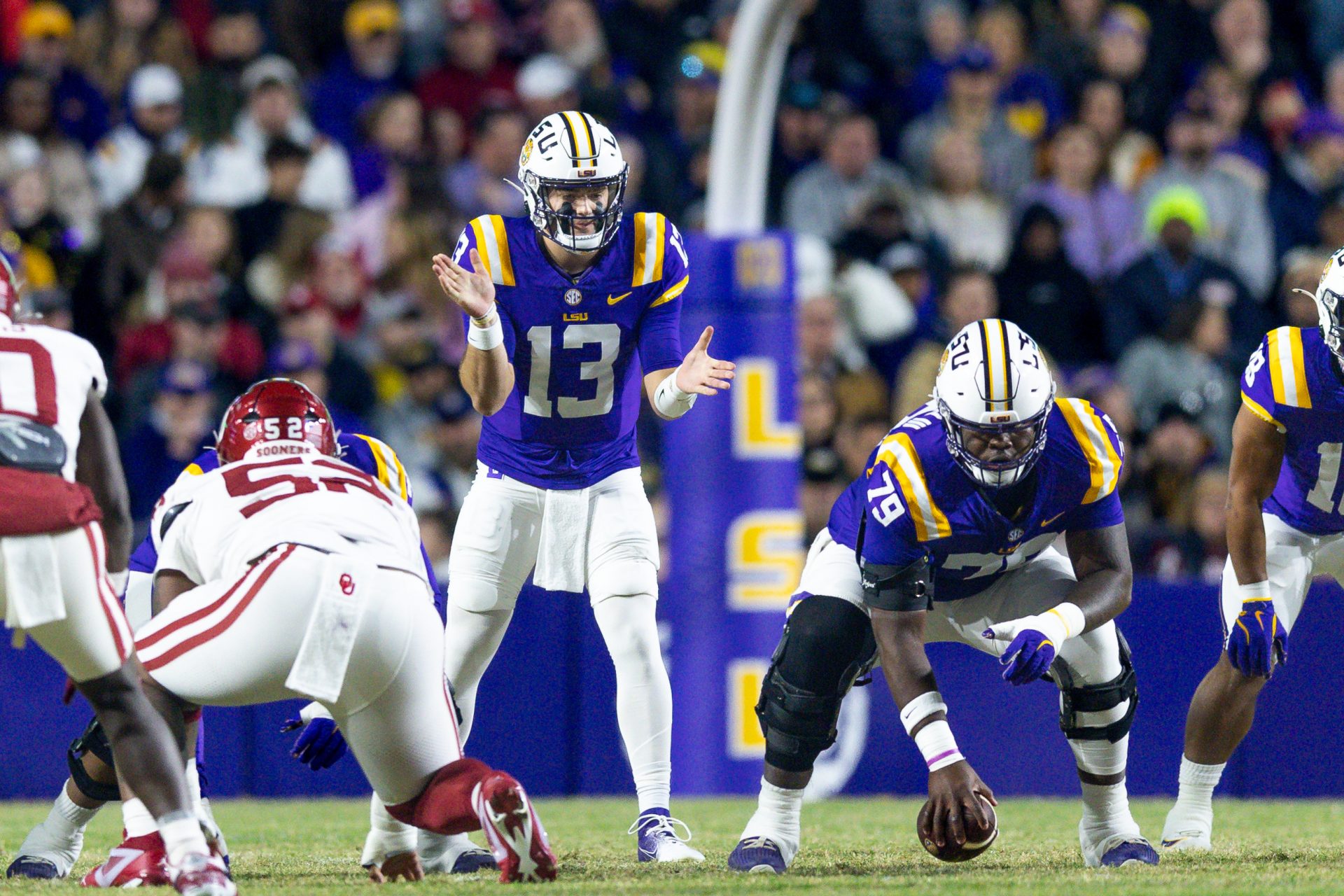 LSU Tigers quarterback Garrett Nussmeier (13) calls for the ball from LSU Tigers offensive lineman DJ Chester (79) against the Oklahoma Sooners during the first quarter at Tiger Stadium.