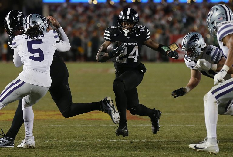 Iowa State Cyclones running back Abu Sama III (24) runs with the ball for a first down against Kansas State Wildcats during the fourth quarter in the NCAA football at Jack Trice Stadium on Saturday, Nov. 30, 2024, in Ames, Iowa.