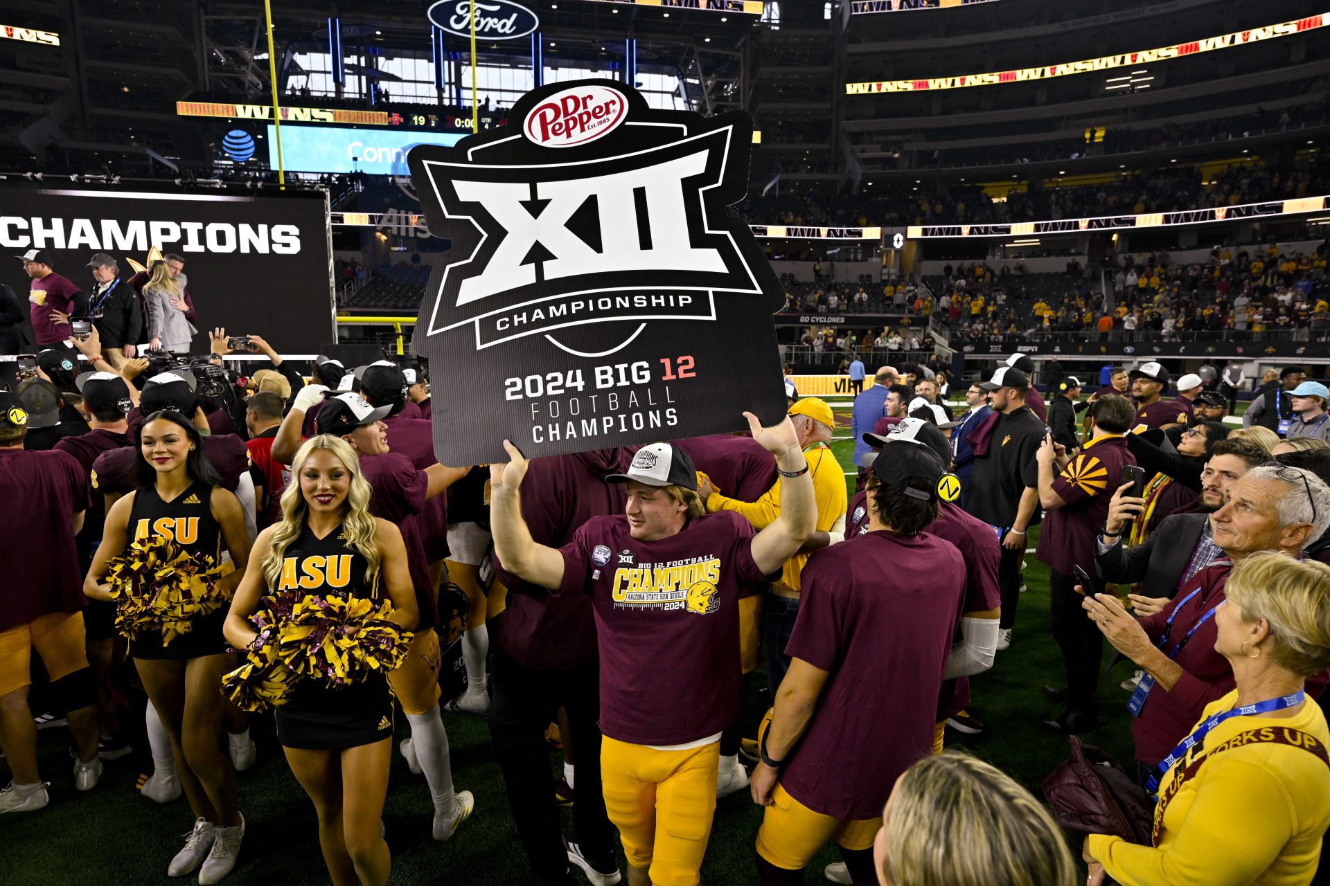 The Arizona State Sun Devils celebrate after the Sun Devils defeat the Iowa State Cyclones at AT&T Stadium.