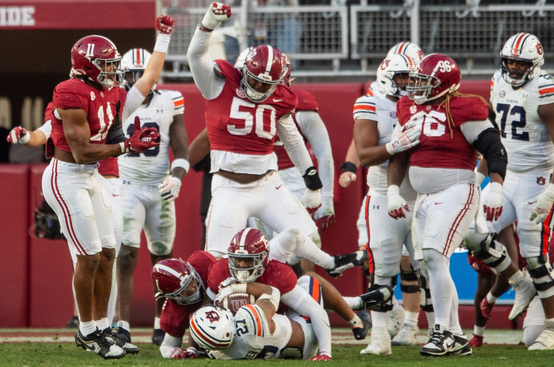 Auburn Tigers running back Jarquez Hunter (27) is stopped during an Alabama Crimson Tide goal line stand at the end of the first half as Auburn Tigers take on Alabama Crimson Tide at Bryant-Denny Stadium in Tuscaloosa, Ala., on Saturday, Nov. 30, 2024. Alabama Crimson Tide leads Auburn Tigers 14-6 at halftime.