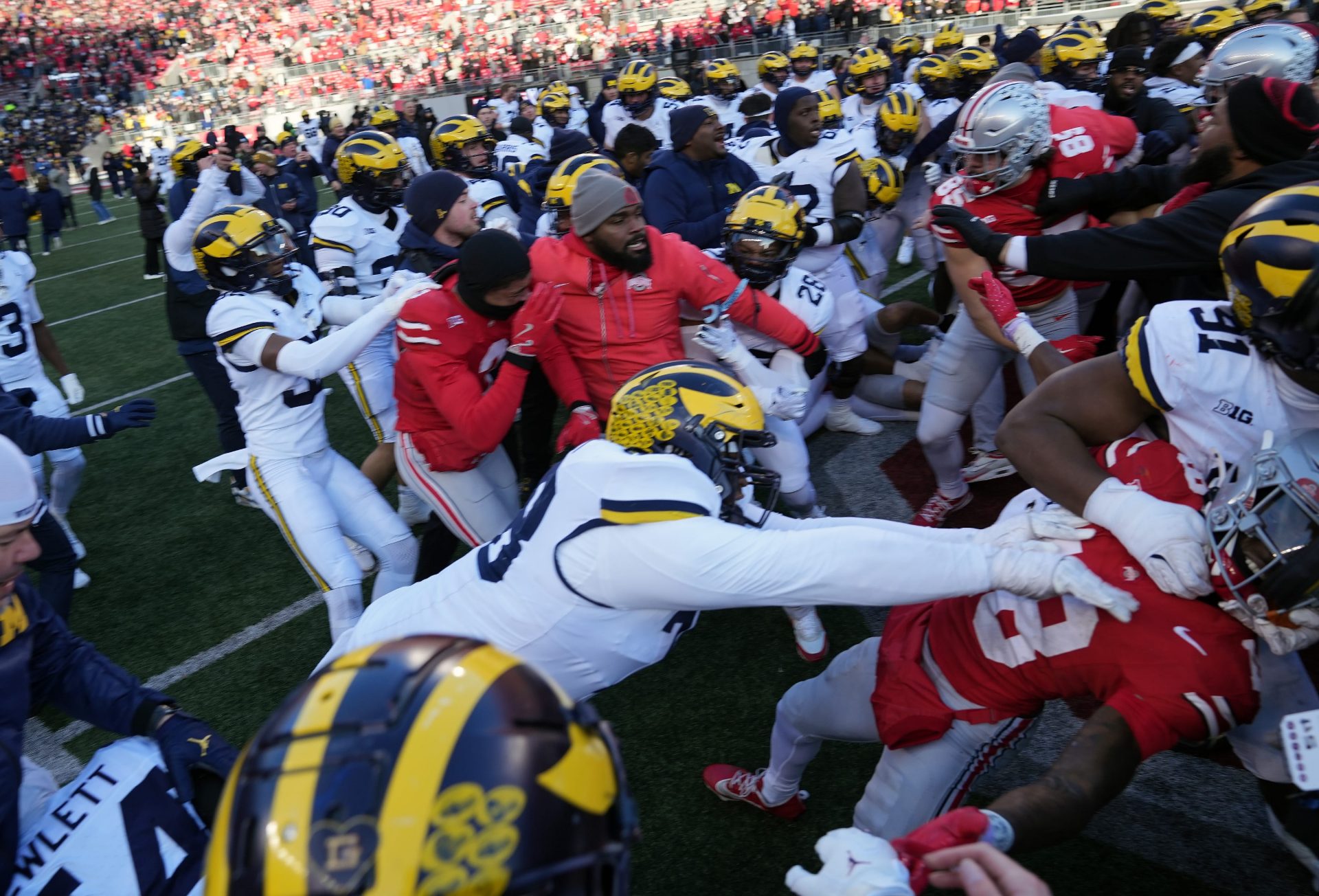Michigan defensive lineman Kenneth Grant (78) goes after Ohio State safety Jaylen McClain (18) after the game during a fight in the middle of the field after the NCAA football game at Ohio Stadium in Columbus on Saturday, Nov. 30, 2024.