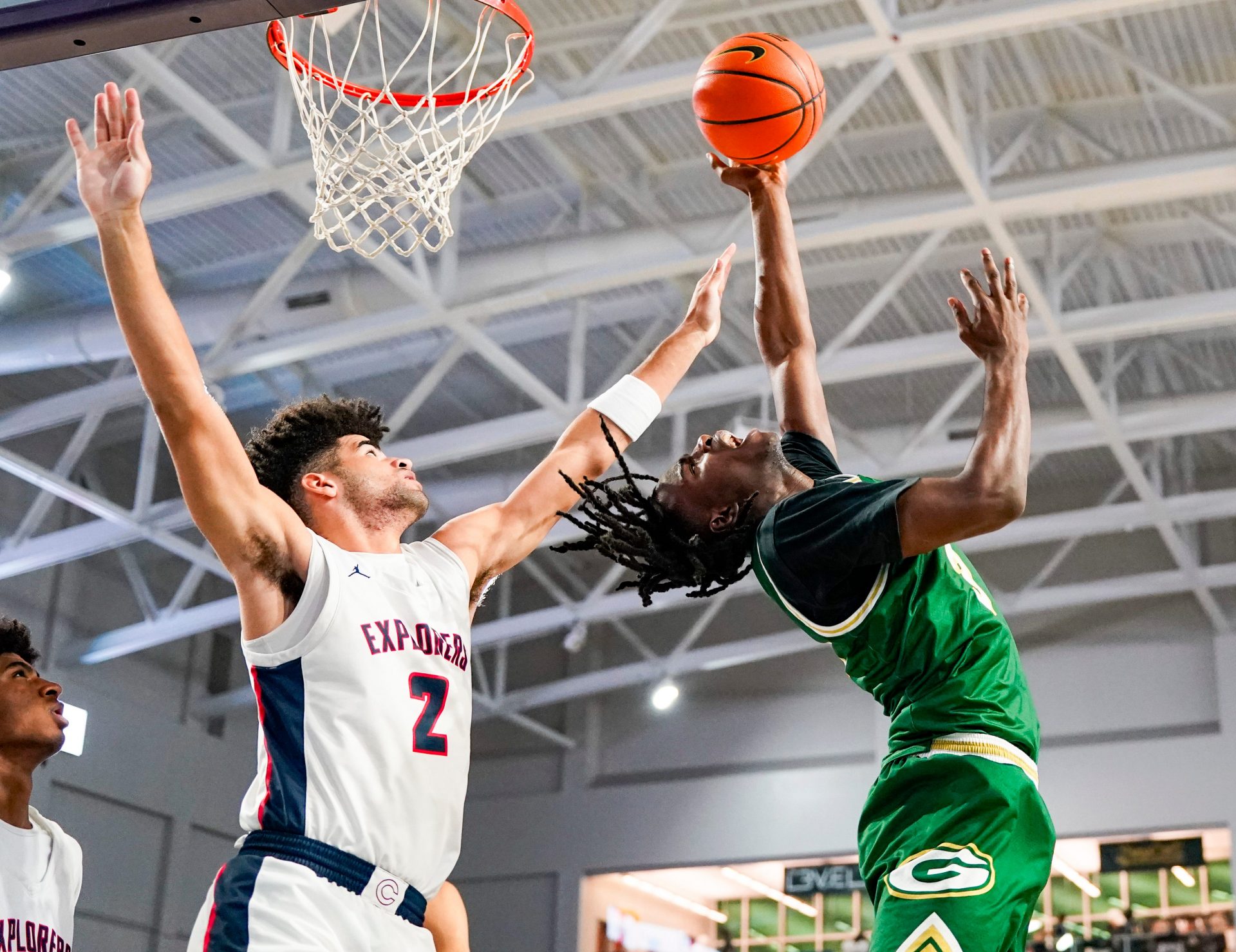 Grayson Rams guard Caleb Holt (3) makes an acrobatic lay up attempt while being guarded by Columbus Explorers guard Cayden Boozer (2) during the first quarter of a City of Palms Classic quarterfinal game at Suncoast Credit Union Arena in Fort Myers, Fla., on Friday, Dec. 20, 2024.