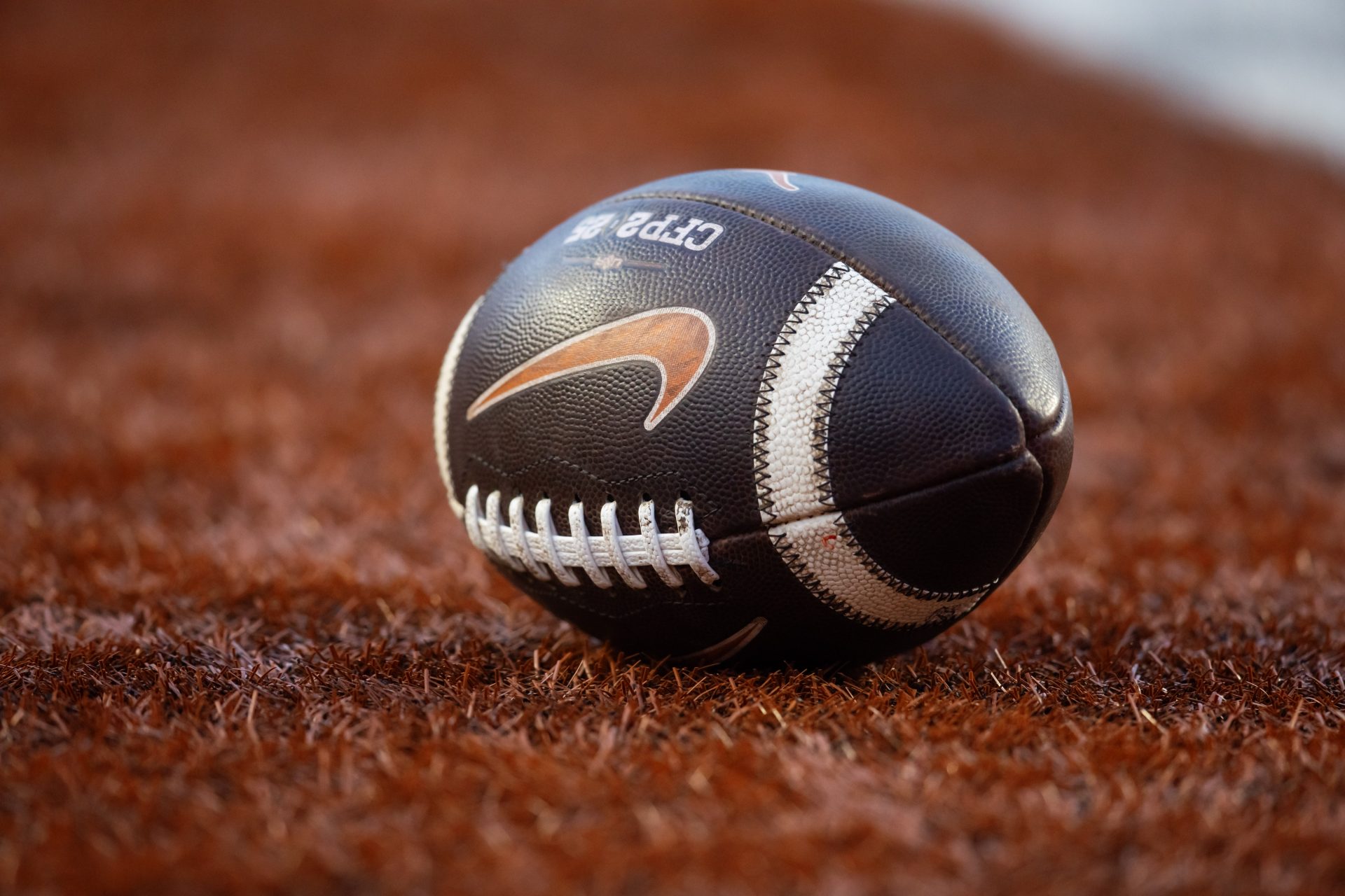 Detailed view of a Nike logo on an official NCAA football during the Clemson Tigers game against the Texas Longhorns in the CFP National playoff first round at Darrell K Royal-Texas Memorial Stadium.