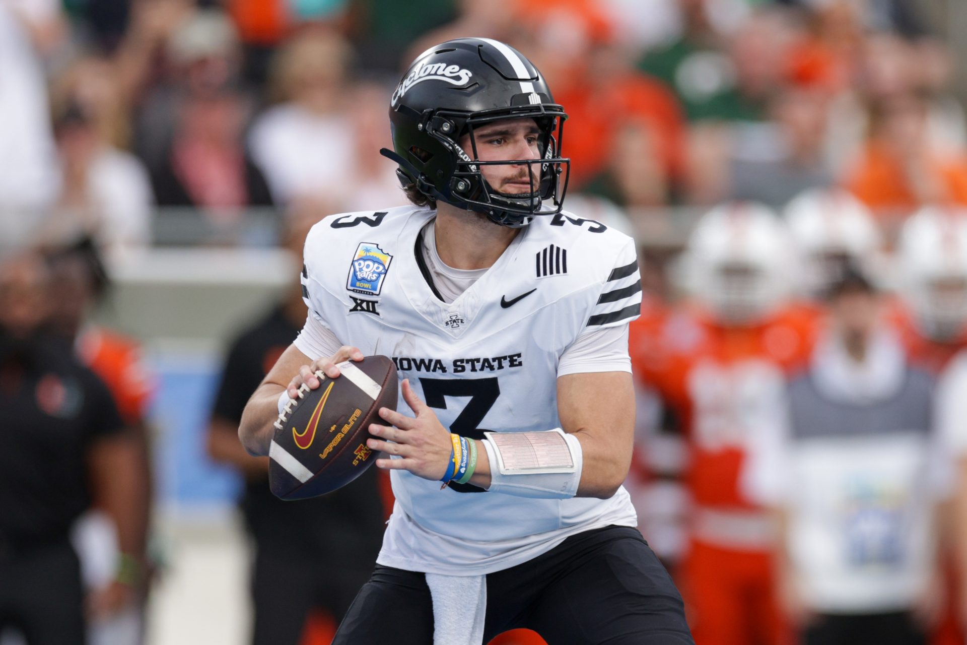 Iowa State Cyclones quarterback Rocco Becht (3) drops back to pass against the Miami Hurricanes in the second quarter during the Pop Tarts bowl at Camping World Stadium.