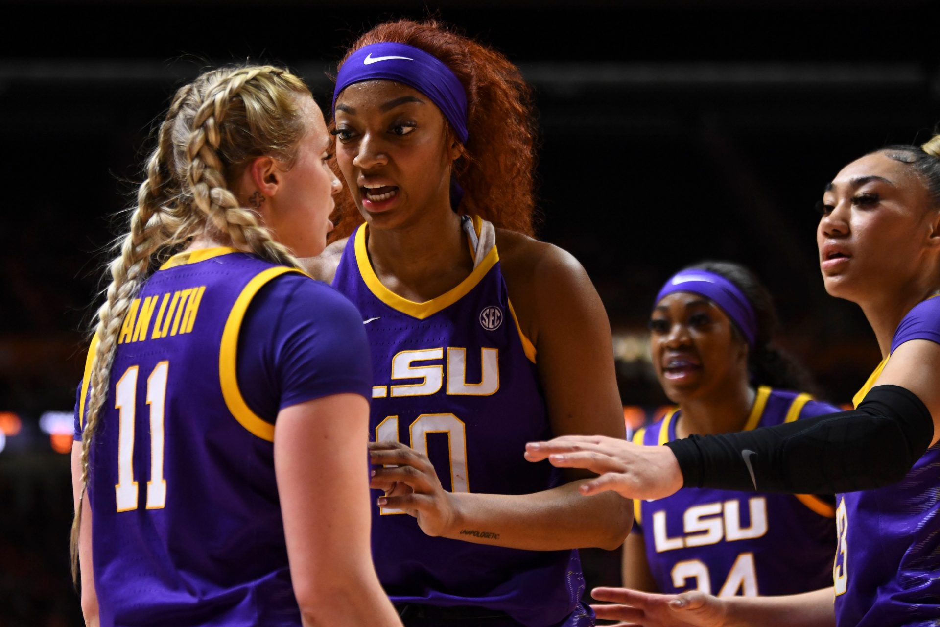LSU's Angel Reese (10) and teammates try to calm Hailey Van Lith (11) after a foul was called against Lith during an NCAA college basketball game against Tennessee on Sunday, February 25, 2024, in Knoxville, Tenn.