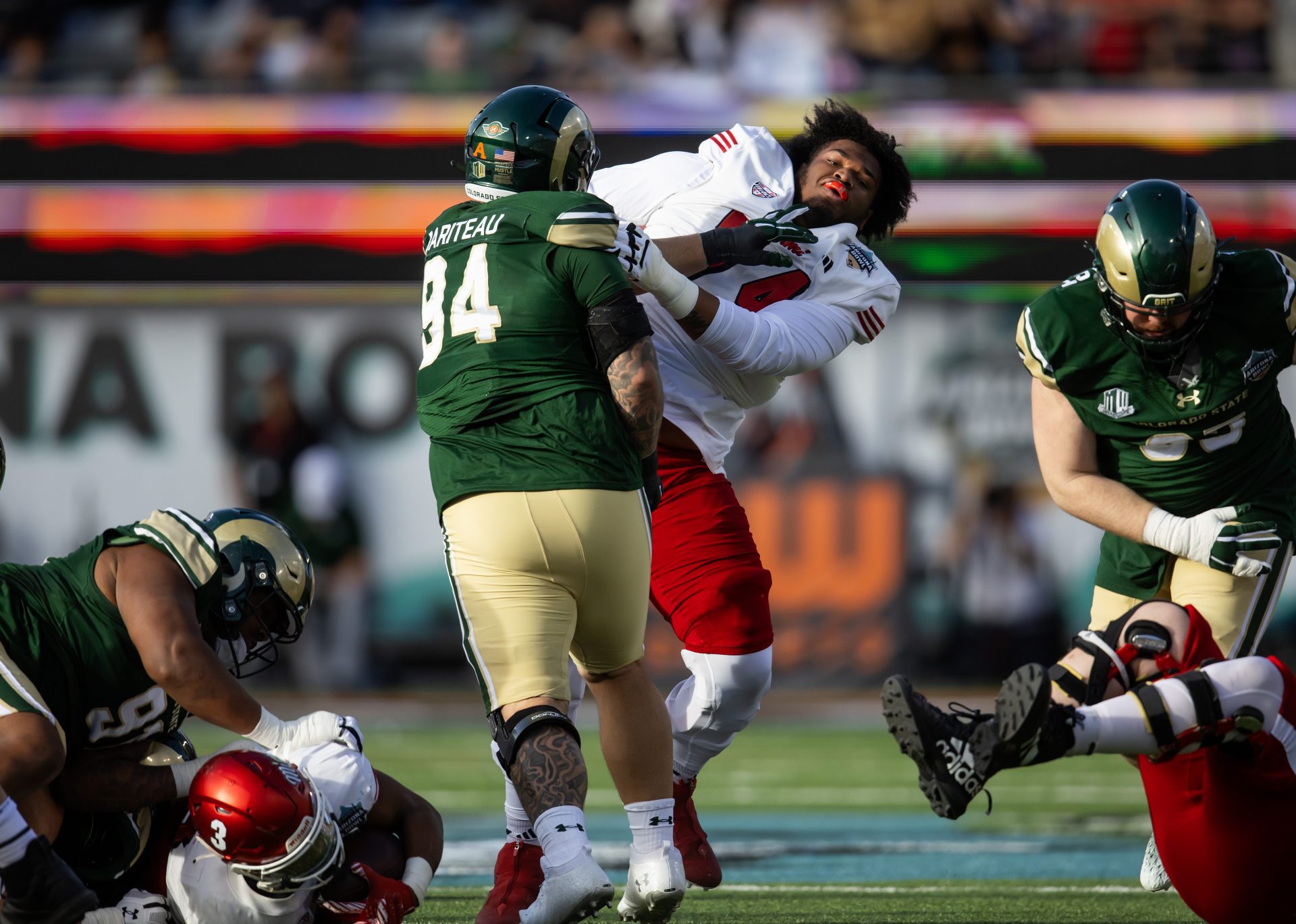 Colorado State Rams defensive lineman Cam Bariteau (94) against Miami (OH) RedHawks offensive lineman Gregory Smith Jr. (74) during the Snoop Dogg Arizona Bowl at Arizona Stadium.