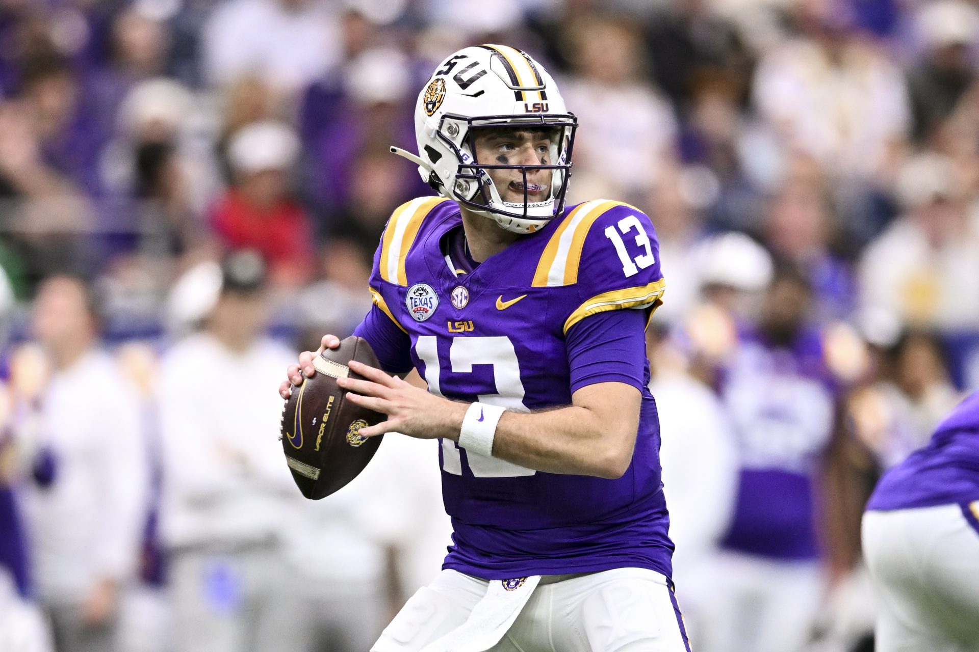 LSU Tigers quarterback Garrett Nussmeier (13) throws a pass during the first half against the Baylor Bears at NRG Stadium.