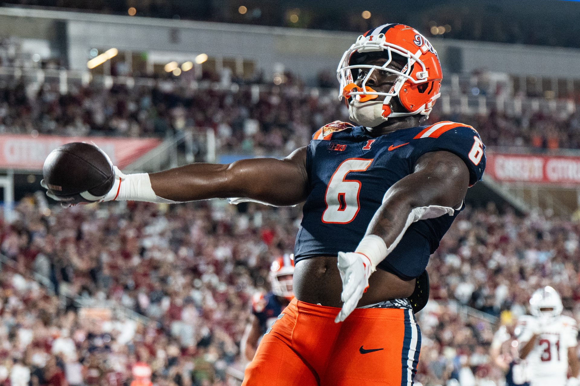 Illinois Fighting Illini running back Josh McCray (6) celebrates his touchdown against the South Carolina Gamecocks in the fourth quarter at Camping World Stadium.