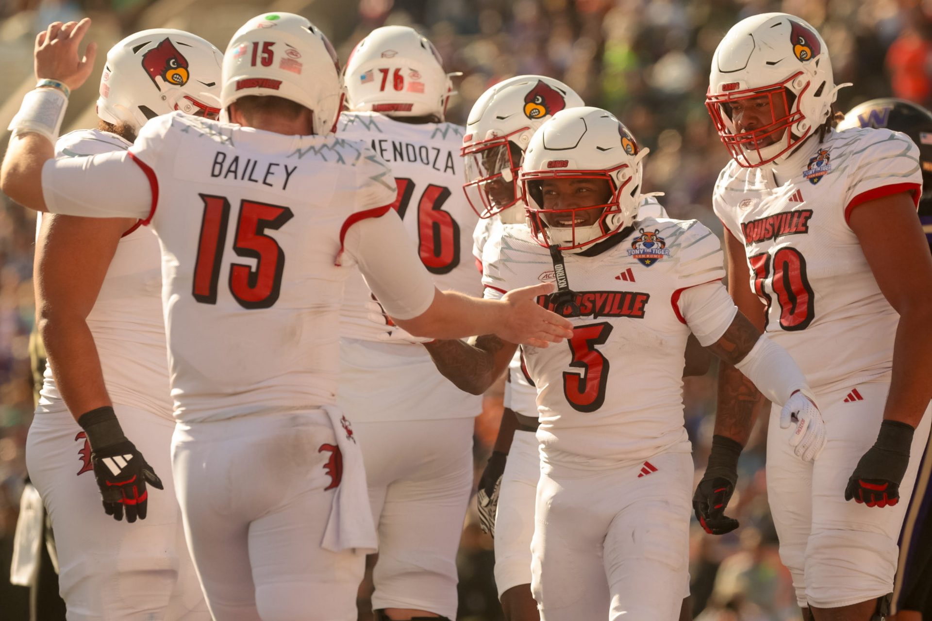 Louisville Caulin Lacy's (5) touchdown is celebrated during the 91st Tony the Tiger Sun Bowl game against Washington on Tuesday, Dec. 31, 2024 at the Sun Bowl Stadium in El Paso, Texas.