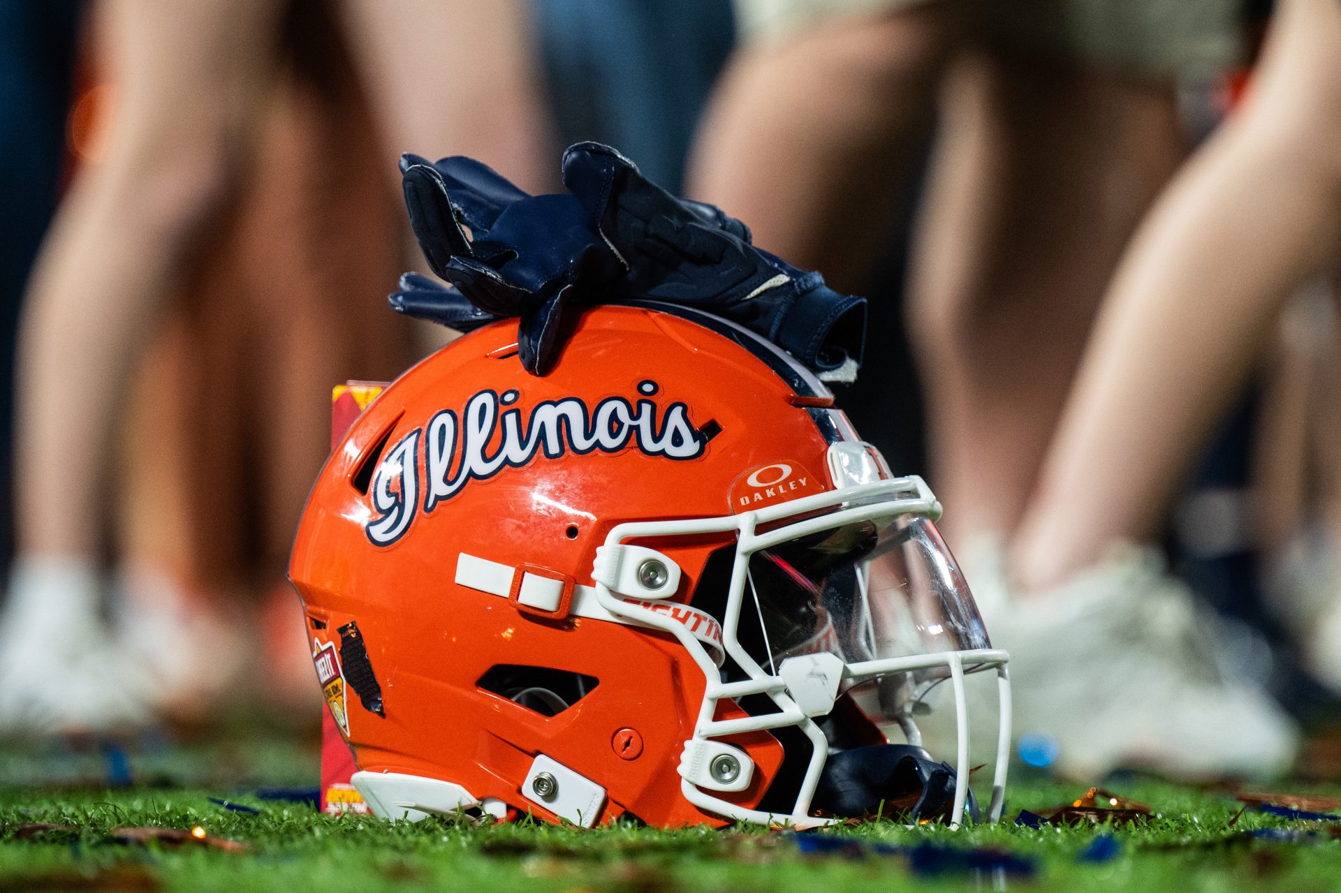 A Illinois Fighting Illini helmet sitting on confetti after the game against the South Carolina Gamecocks at Camping World Stadium.