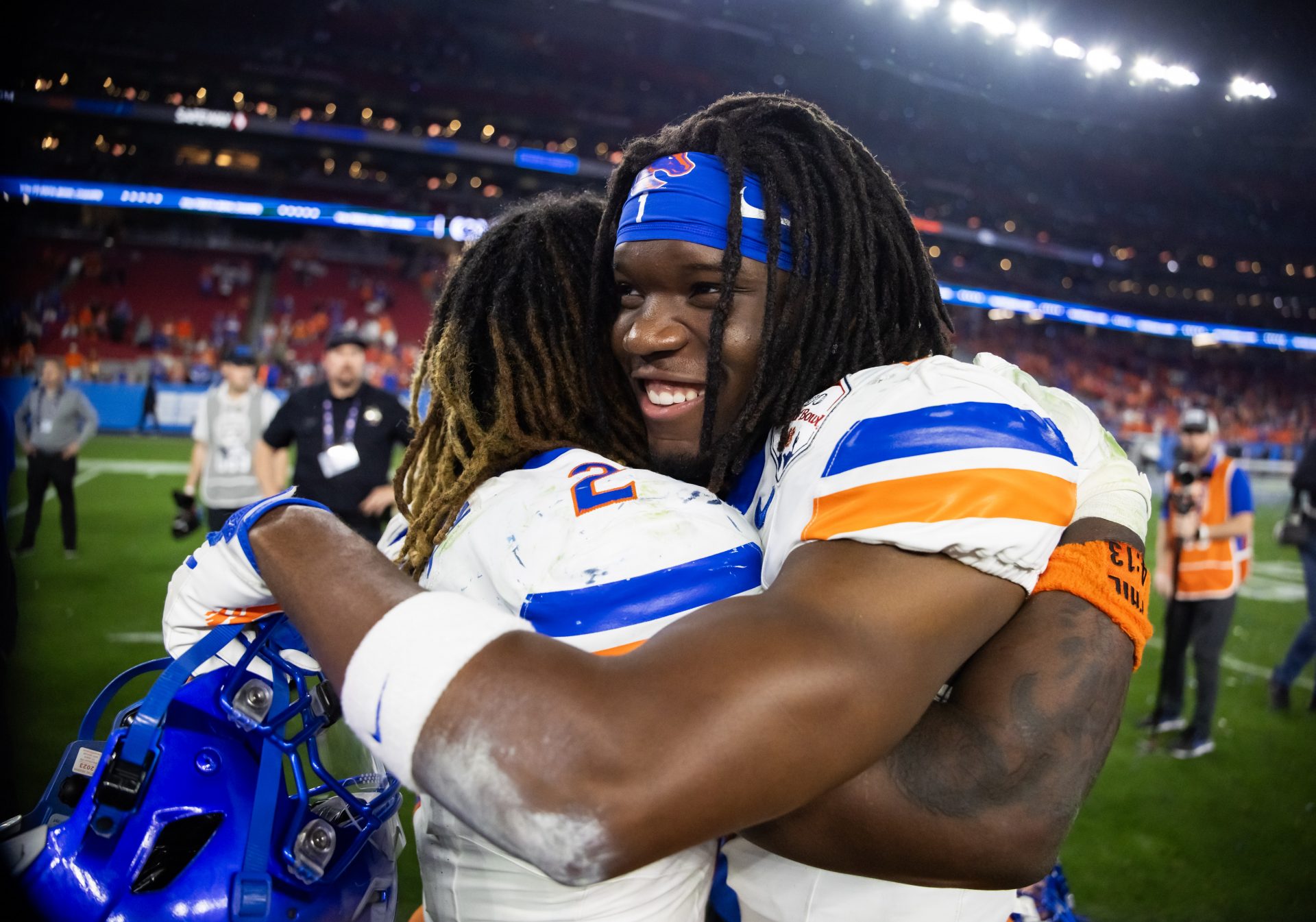 Boise State Broncos running back Jambres Dubar (right) hugs Ashton Jeanty following the game against the Penn State Nittany Lions during the Fiesta Bowl at State Farm Stadium.