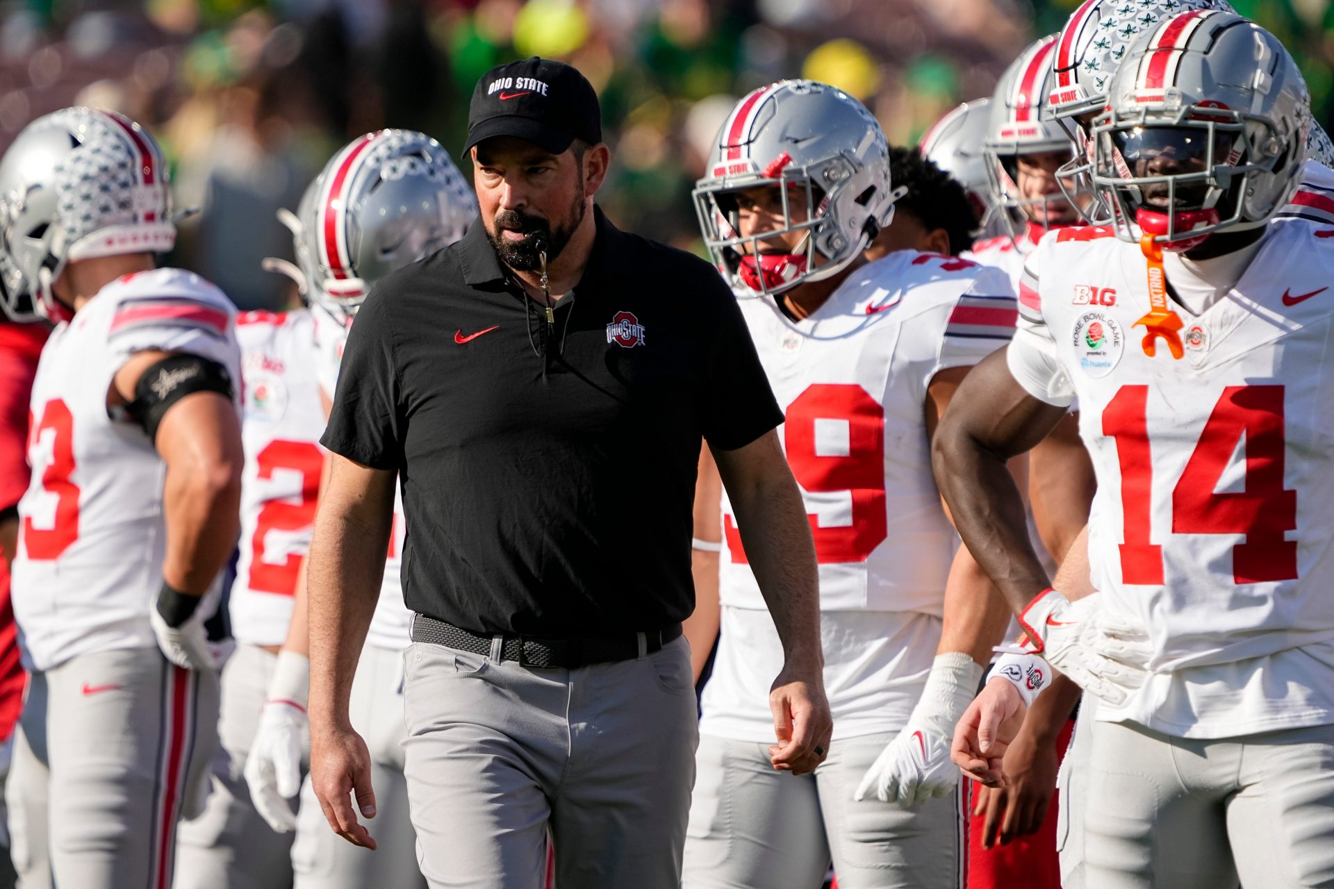 Ohio State Buckeyes head coach Ryan Day leads warm ups for the College Football Playoff quarterfinal against the Oregon Ducks at the Rose Bowl in Pasadena, Calif. on Jan. 1, 2025. Ohio State won 41-21.