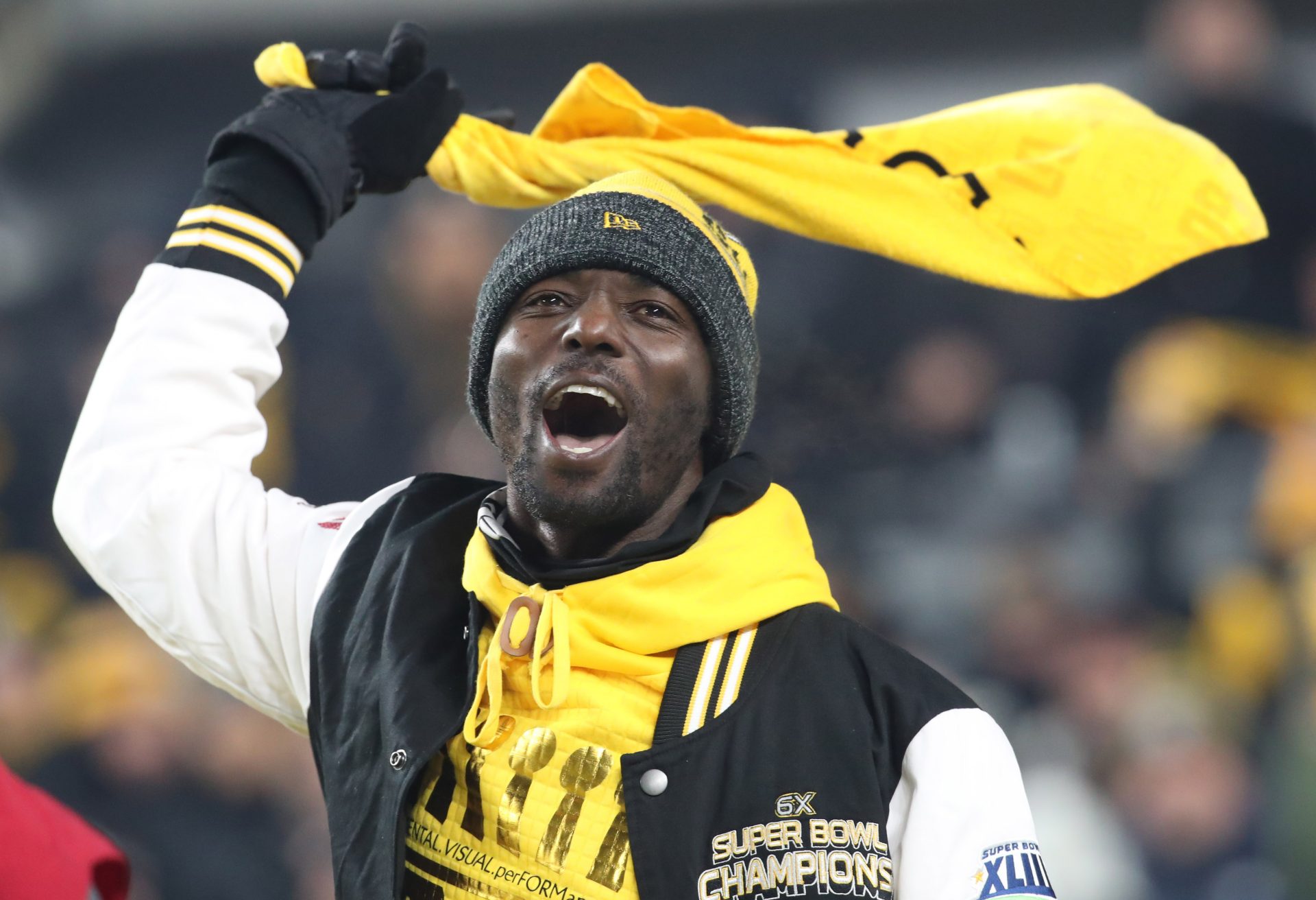 Pittsburgh Steelers former wide receiver and Super Bowl XLIII MVP Santonio Holmes leads the Terrible Towel wave before the game against the Cincinnati Bengals at Acrisure Stadium.
