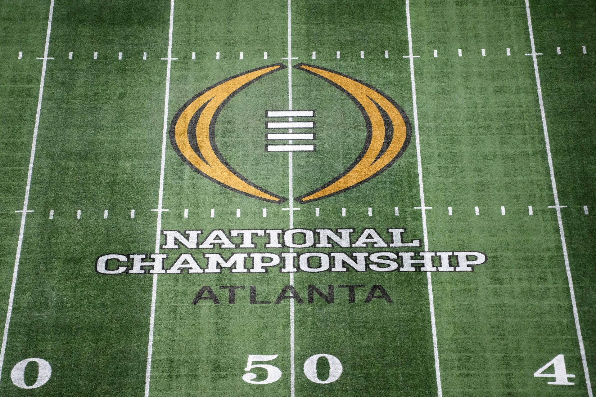 The College Football Playoff National Championship logo at midfield at Mercedes-Benz Stadium, the site of the 2025 College Football Playoff National Championship between the Ohio State Buckeyes and the Notre Dame Fighting Irish.