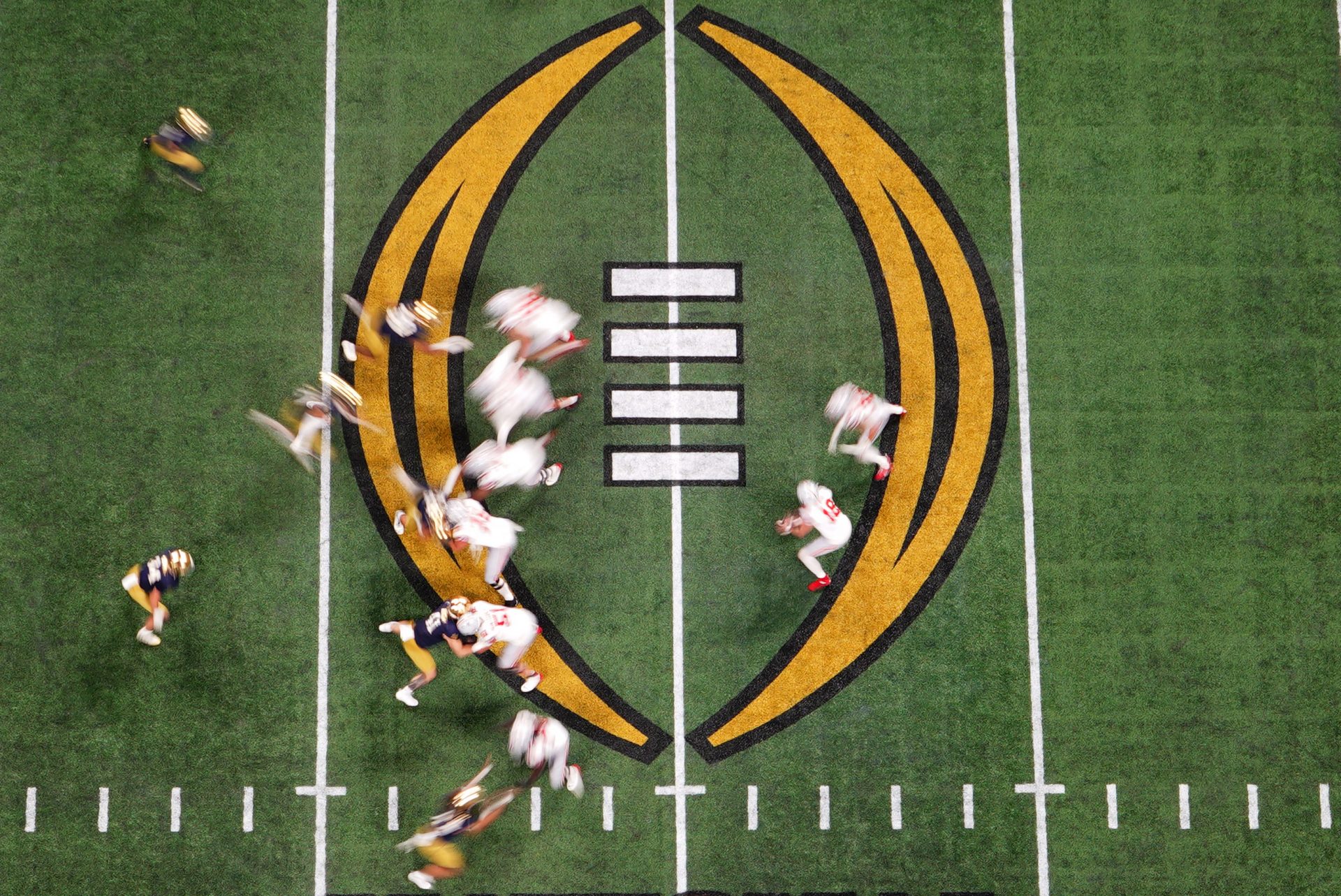 Ohio State Buckeyes quarterback Will Howard (18) prepares to hand off the ball during the third quarter against the Notre Dame Fighting Irish in the College Football Playoff National Championship game at Mercedes-Benz Stadium.