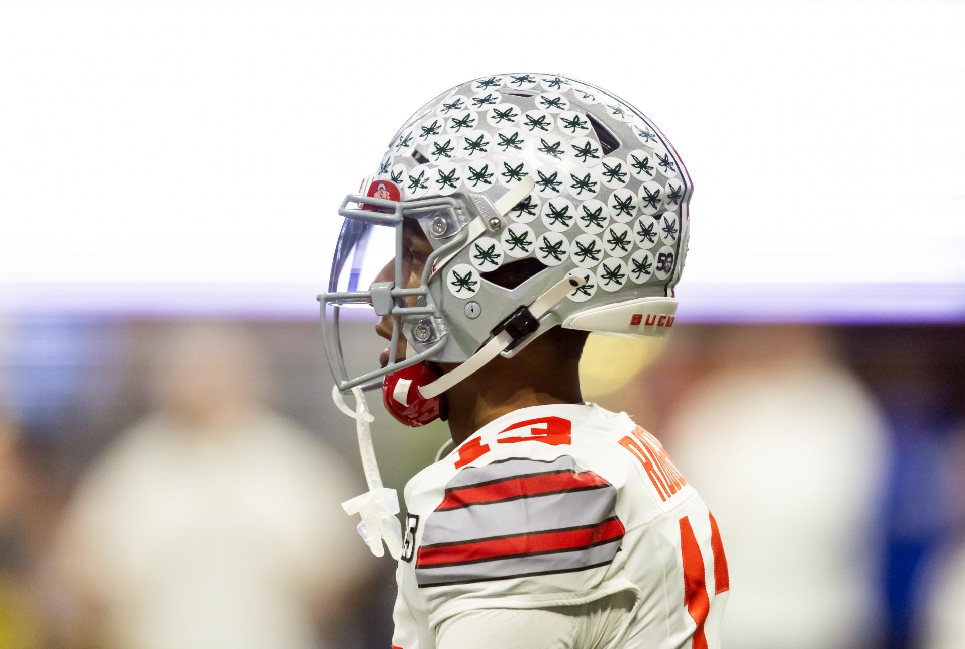 Detailed view of buckeye leave stickers on the helmet of Ohio State Buckeyes wide receiver Bryson Rodgers (13) against the Notre Dame Fighting Irish during the CFP National Championship college football game at Mercedes-Benz Stadium.
