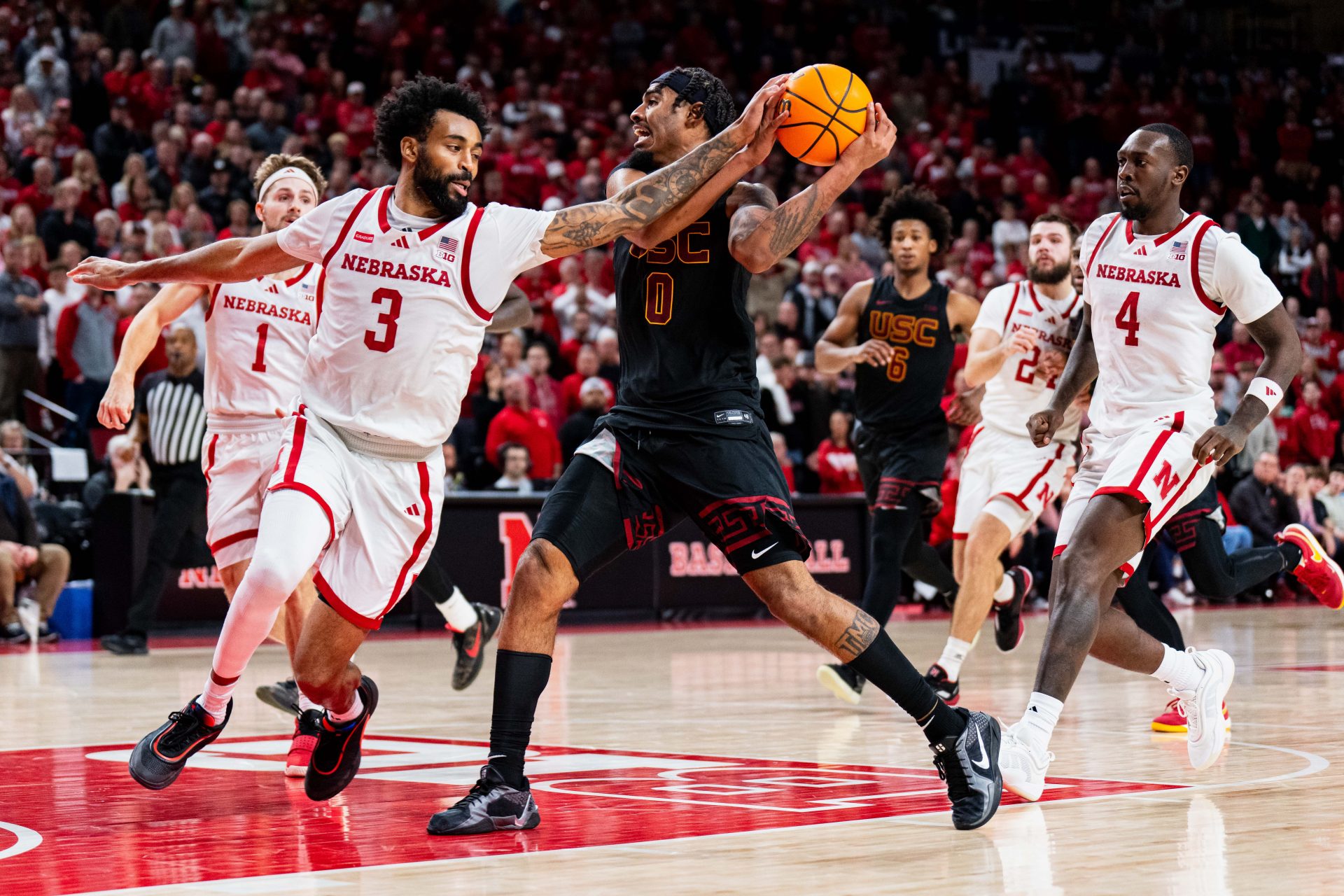Nebraska Cornhuskers guard Brice Williams (3) fouls Southern California Trojans forward Saint Thomas (0) during the second half at Pinnacle Bank Arena.