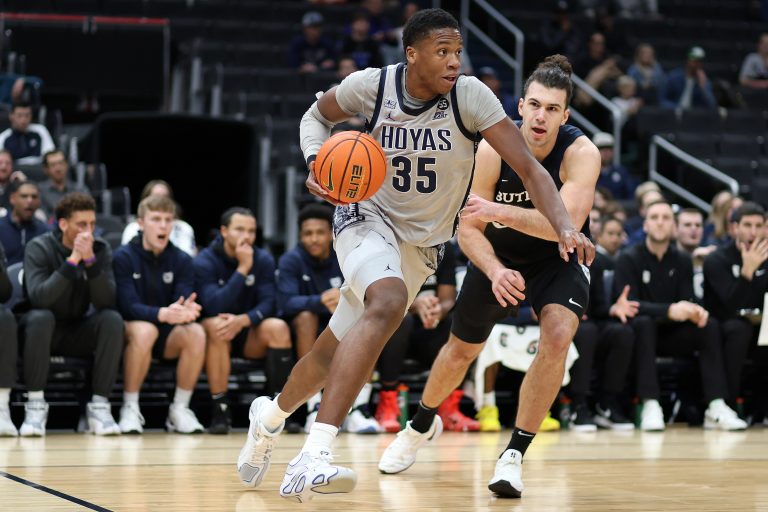 Georgetown Hoyas forward Thomas Sorber (35) drives past Butler Bulldogs forward Boden Kapke (33) during the first half at Capital One Arena.