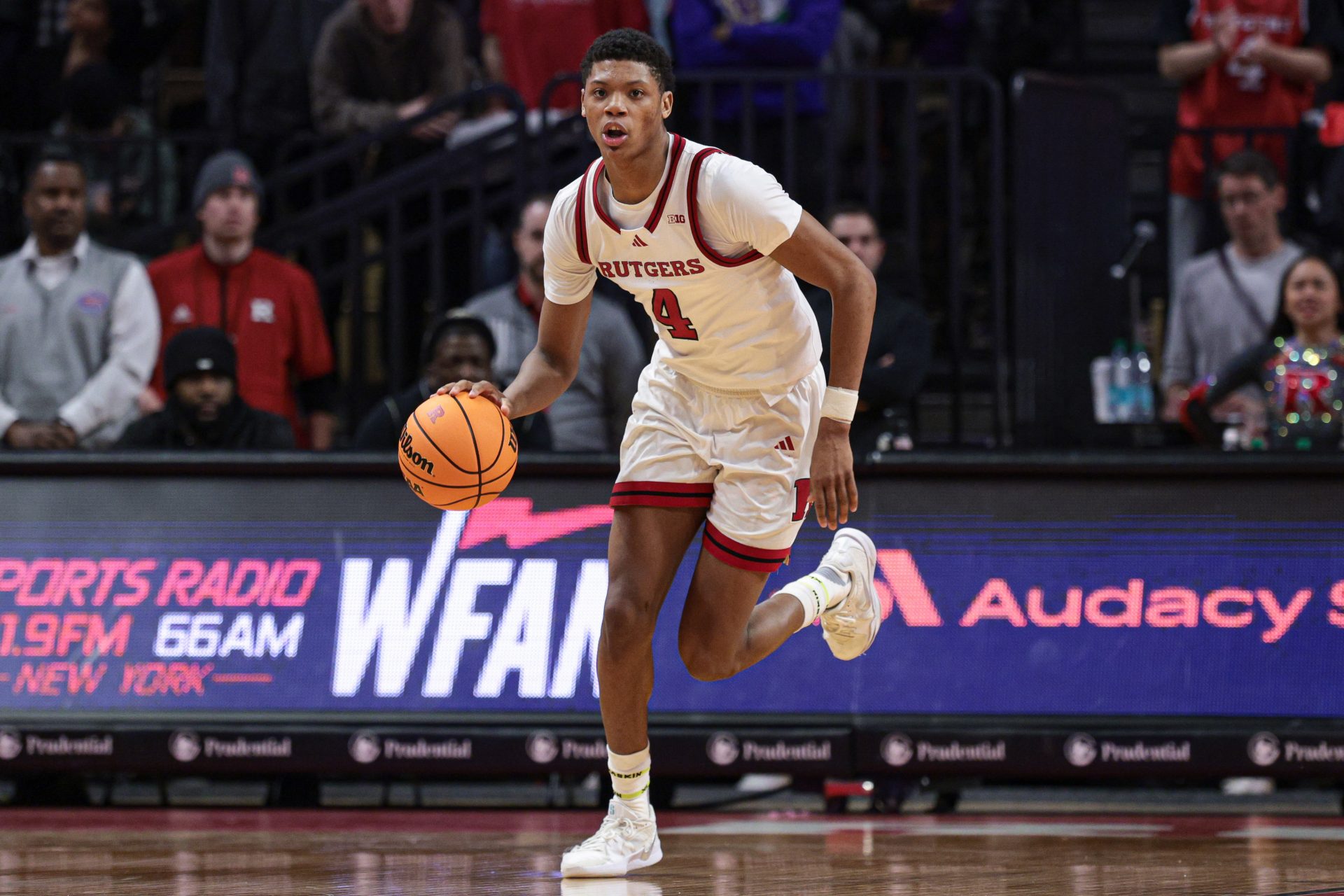 Rutgers Scarlet Knights guard Ace Bailey (4) dribbles up court during the second half against the Iowa Hawkeyes at Jersey Mike's Arena.