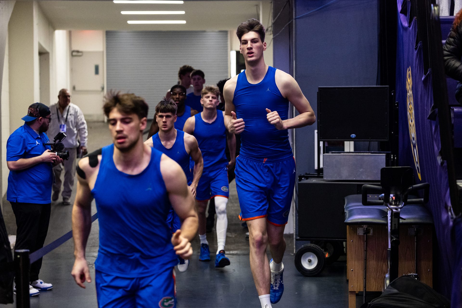 Florida Gators center Olivier Rioux (32) comes out the tunnel with the team against the LSU Tigers during the first half at Pete Maravich Assembly Center.
