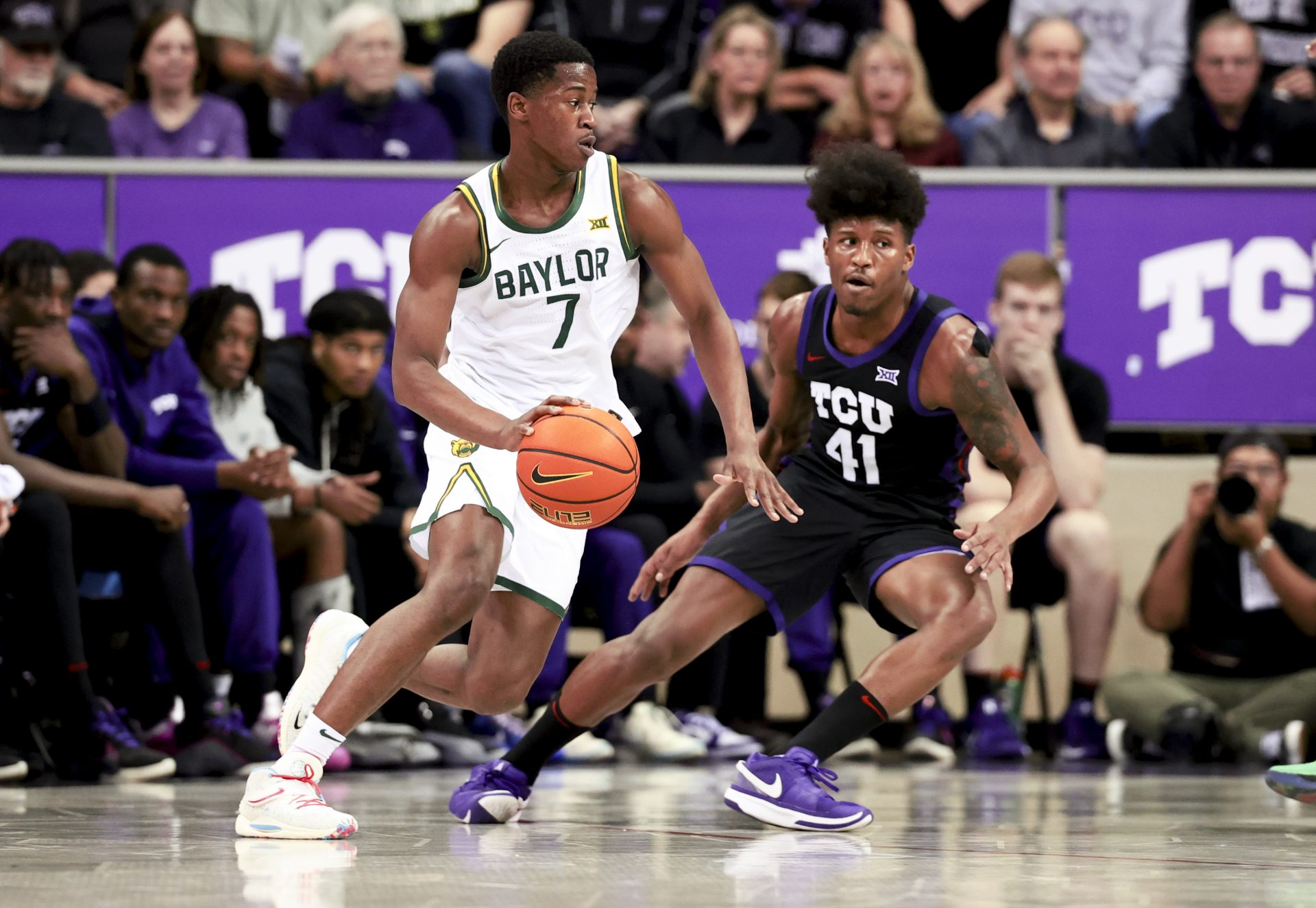 Baylor Bears guard VJ Edgecombe (7) controls the ball as TCU Horned Frogs guard Jace Posey (41) defends during the first half at Ed and Rae Schollmaier Arena.