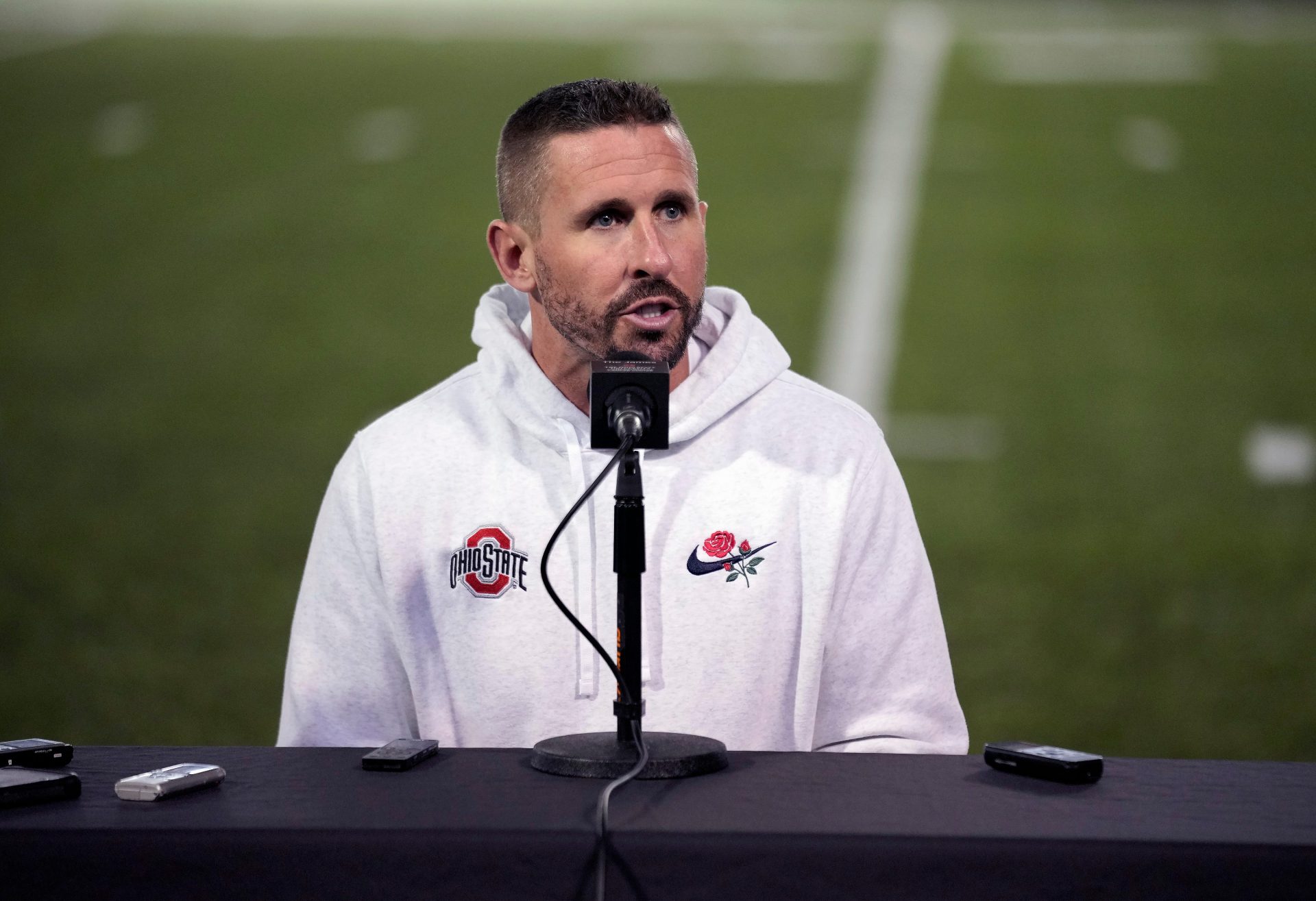 Ohio State offensive coordinator Brian Hartline speaks to the meeting during a press conference before the start of spring football at the Woody Hayes Athletic Center on March 7, 2025.