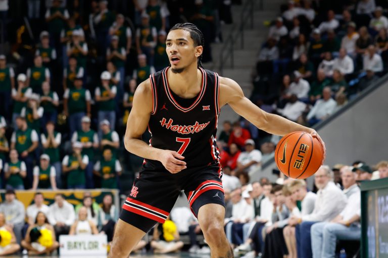 Houston Cougars guard Milos Uzan (7) controls the ball against the Baylor Bears during the first half at Paul and Alejandra Foster Pavilion.