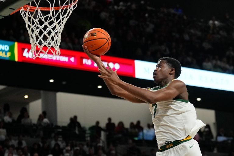 Baylor Bears guard VJ Edgecombe (7) scores a layup against the Houston Cougars during the second half at Paul and Alejandra Foster Pavilion.