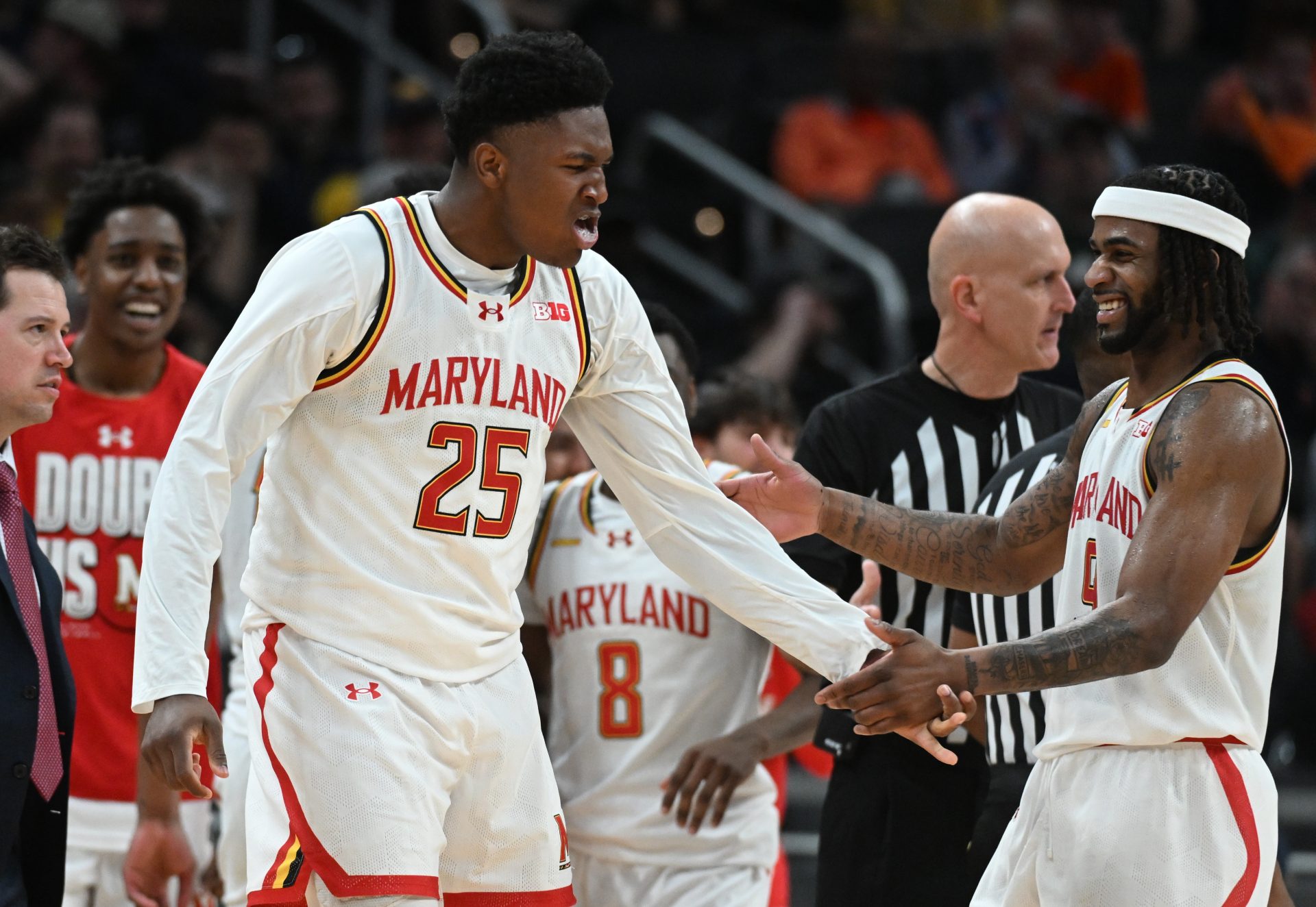 Maryland Terrapins center Derik Queen (25) celebrates with guard Selton Miguel (9) after a play during the second half against the Illinois Fighting Illini at Gainbridge Fieldhouse.