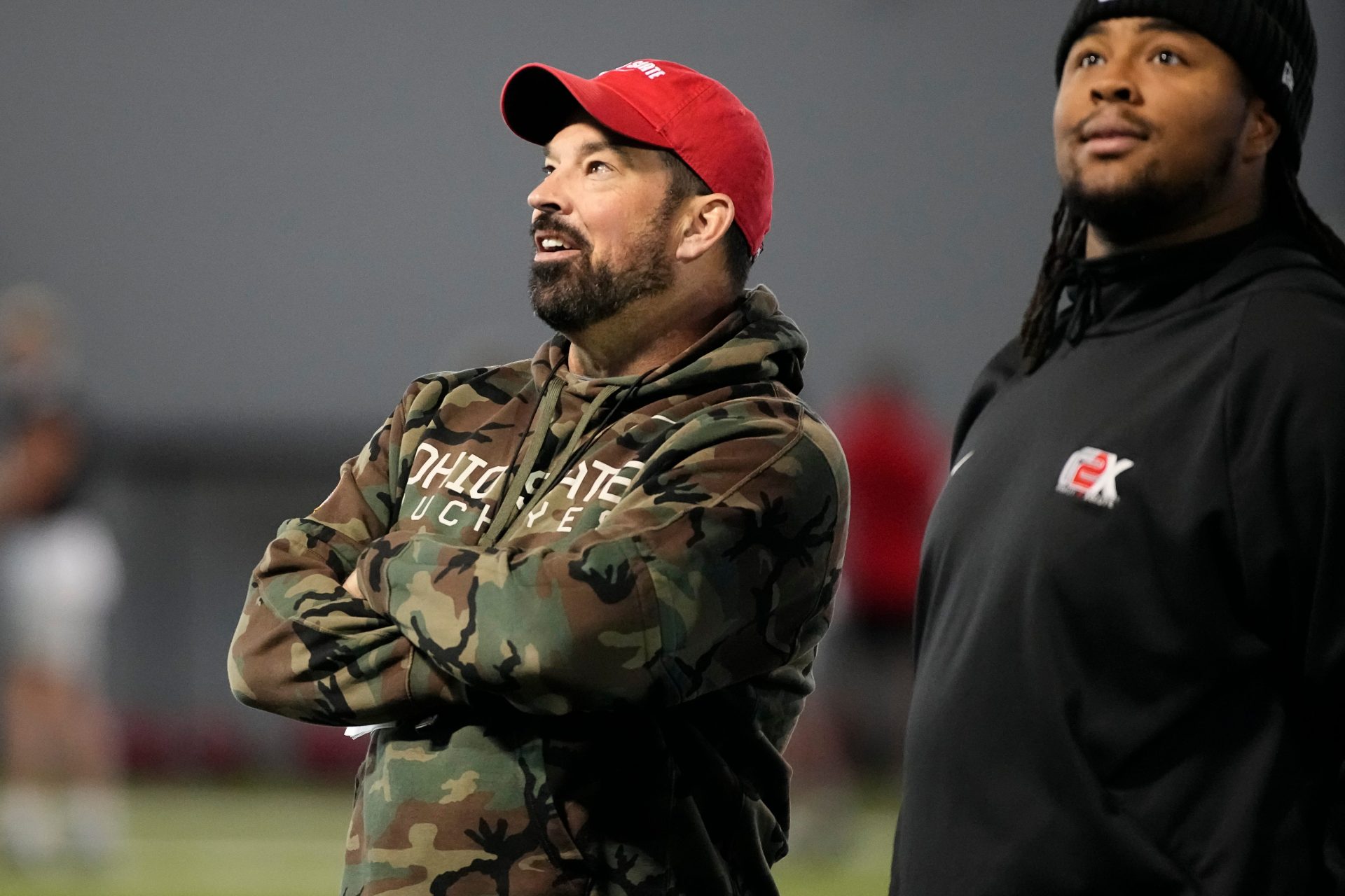 Ohio State Buckeyes head coach Ryan Day admires the new banners on the wall alongside Tyliek Williams during spring football practice at the Woody Hayes Athletic Center on March 17, 2025.