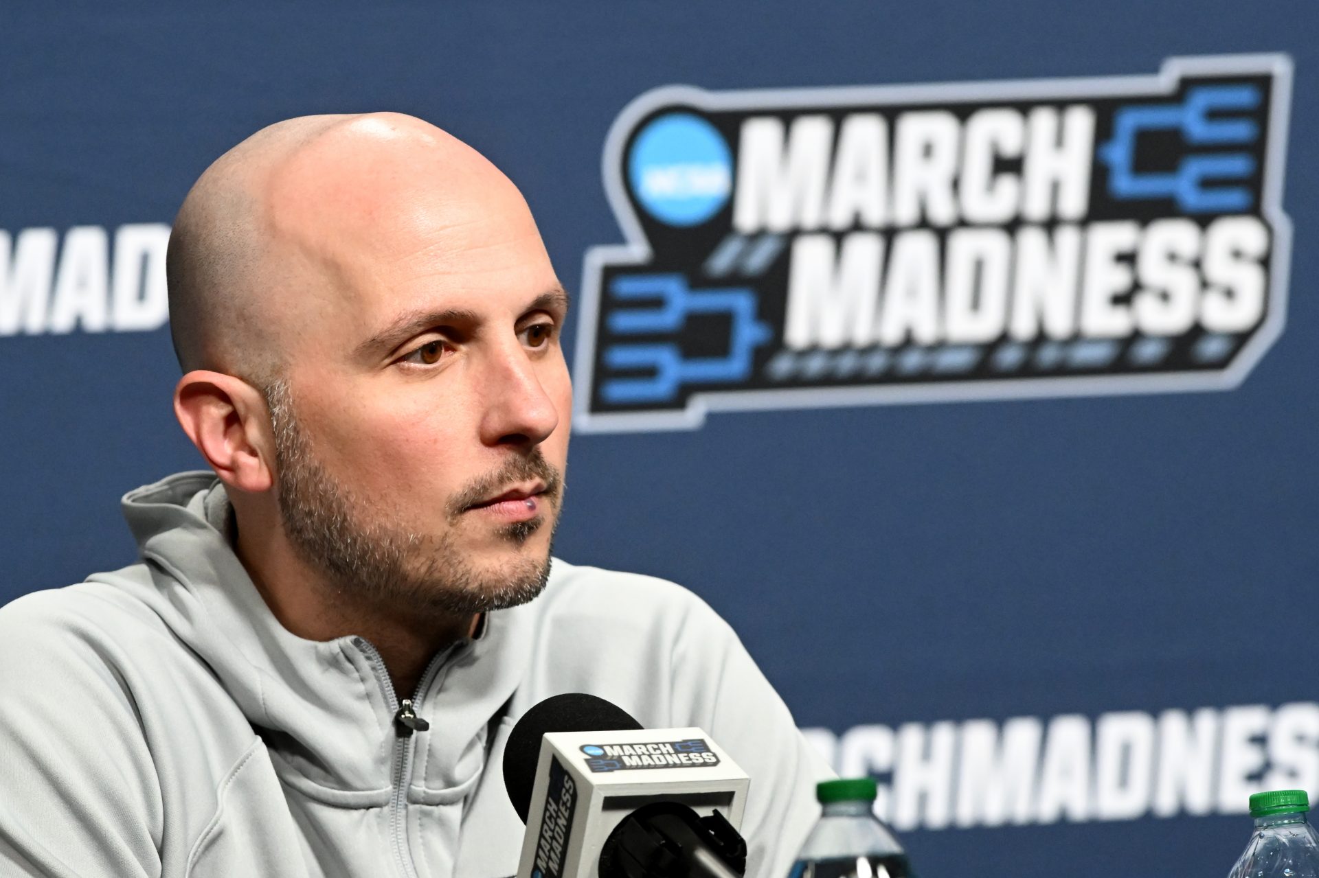Bryant University Bulldogs head coach Phil Martelli Jr. talks to the media before practice at Rocket Arena.
