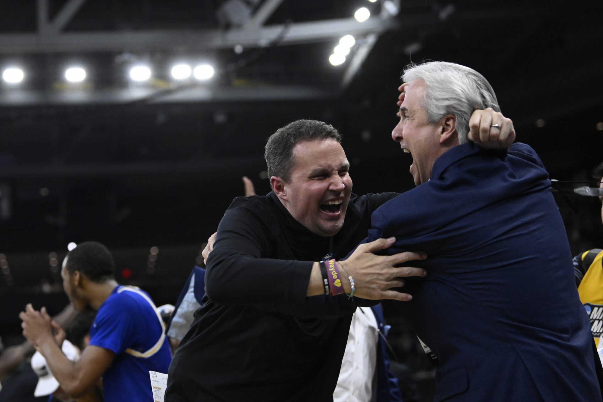 McNeese State Cowboys head coach Will Wade (middle) celebrates with McNeese University president Wade Rousse (right) after defeating the Clemson Tigers at Amica Mutual Pavilion.