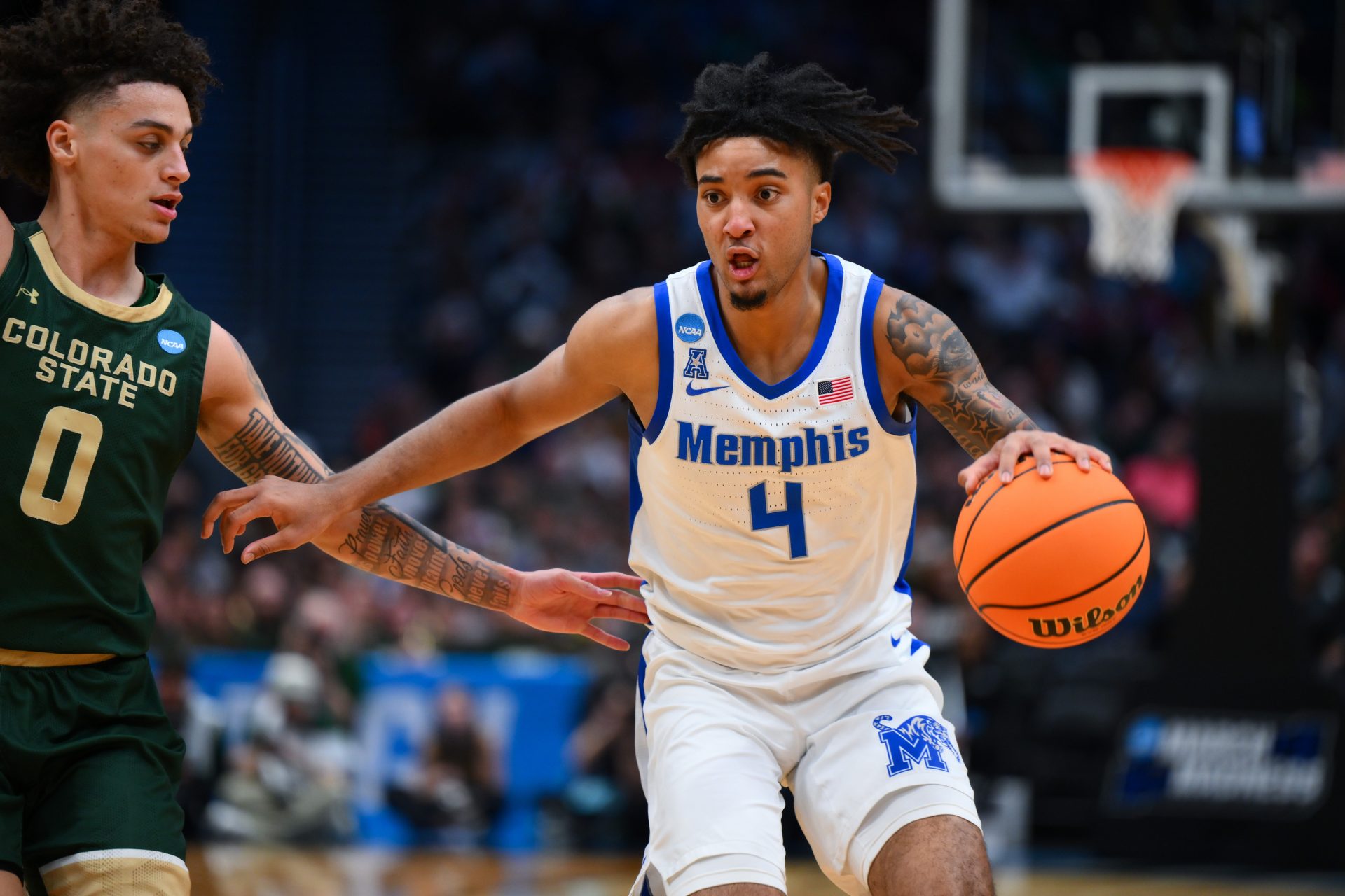 Memphis Tigers guard PJ Haggerty (4) drives the ball during the second half against Colorado State Rams at Climate Pledge Arena.
