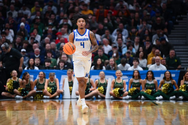 Memphis Tigers guard PJ Haggerty (4) drives the ball during the second half against Colorado State Rams at Climate Pledge Arena.