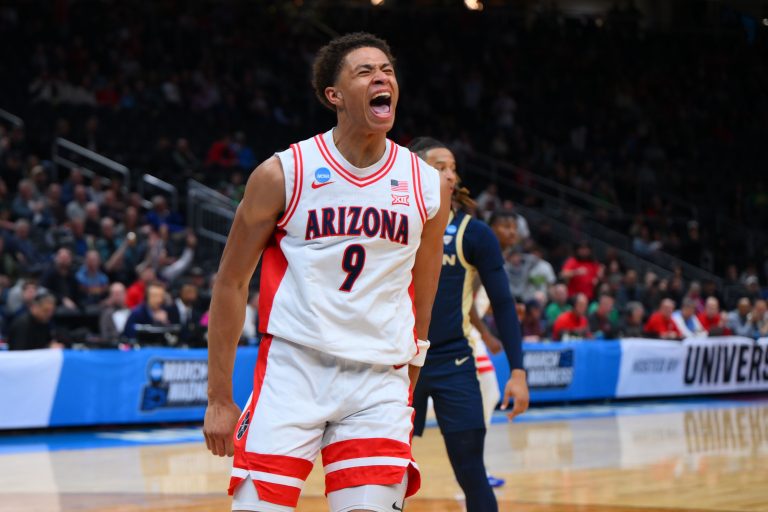 Arizona Wildcats forward Carter Bryant (9) reacts after dunking the ball against the Akron Zips during the first half in the first round of the NCAA Tournament at Climate Pledge Arena.