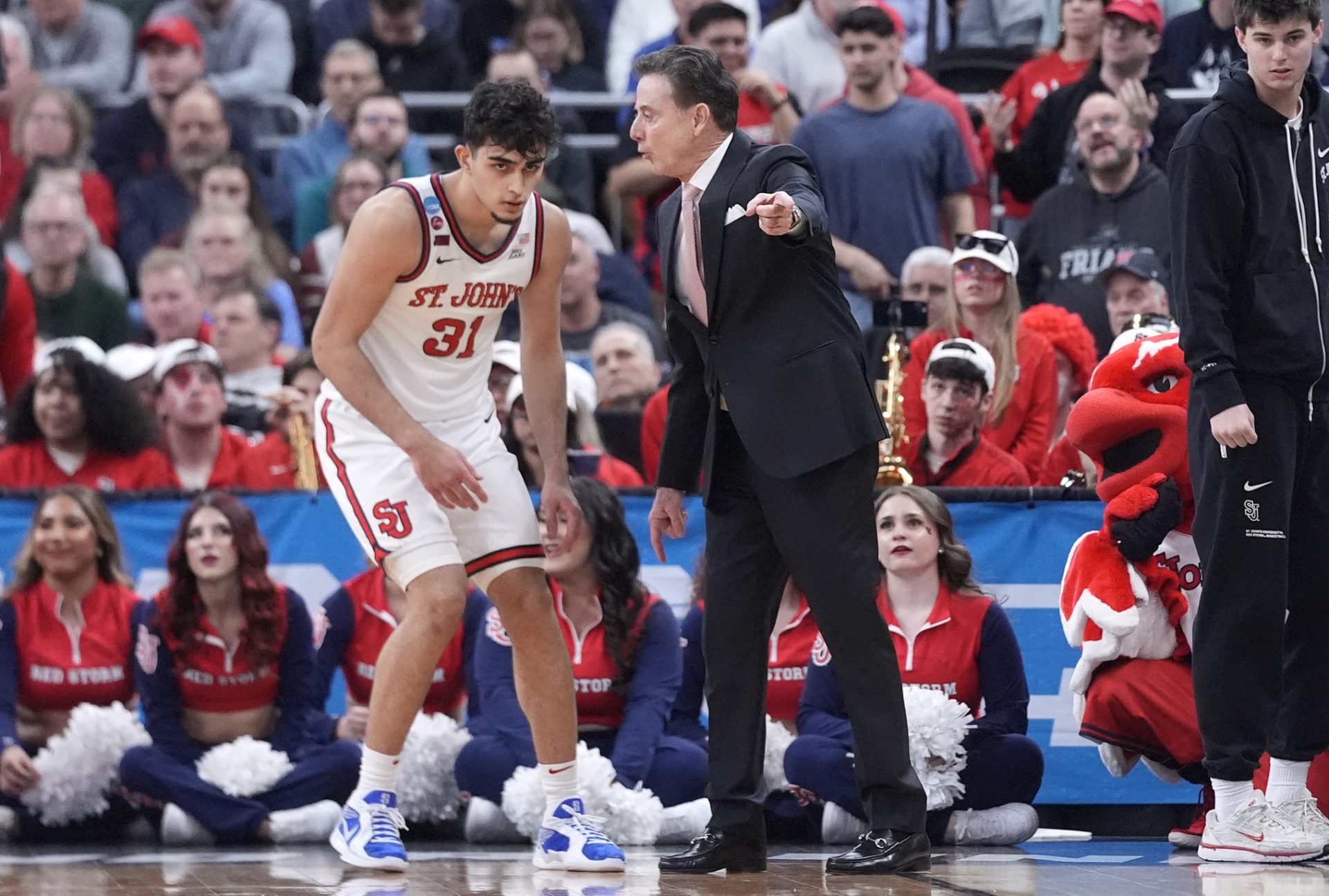St. John's Red Storm head coach Rick Pitino talks to guard Lefteris Liotopoulos (31) during the first half of a second round men’s NCAA Tournament game against the Arkansas Razorbacks at Amica Mutual Pavilion.