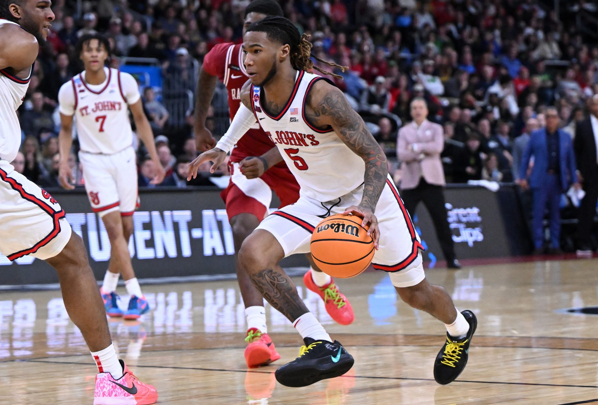 St. John's Red Storm guard Deivon Smith (5) drives during the second half of a second round men’s NCAA Tournament game against the Arkansas Razorbacks at Amica Mutual Pavilion.