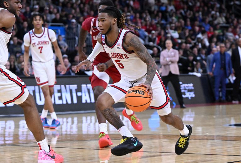 St. John's Red Storm guard Deivon Smith (5) drives during the second half of a second round men’s NCAA Tournament game against the Arkansas Razorbacks at Amica Mutual Pavilion.