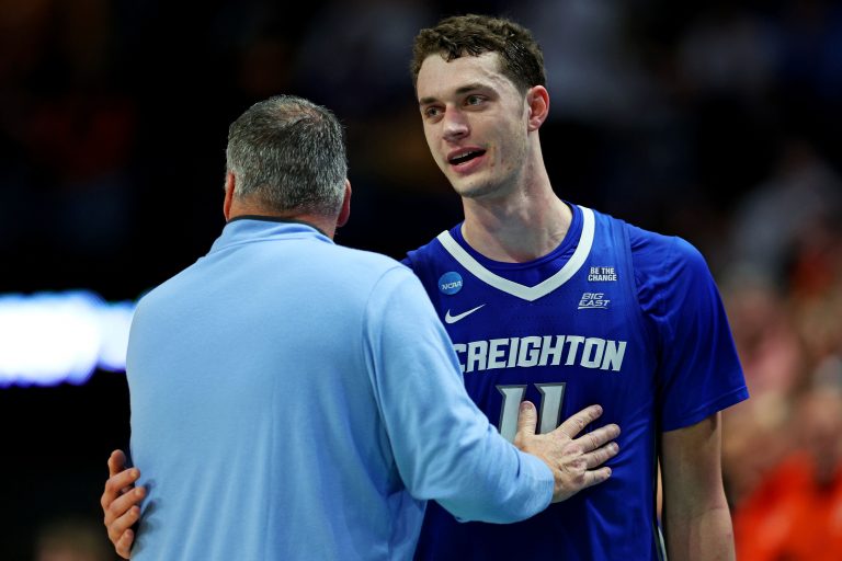 Creighton Bluejays center Ryan Kalkbrenner (11) reacts with head coach Greg McDermott during the second half against the Auburn Tigers in the second round to the NCAA Tournament at Rupp Arena.