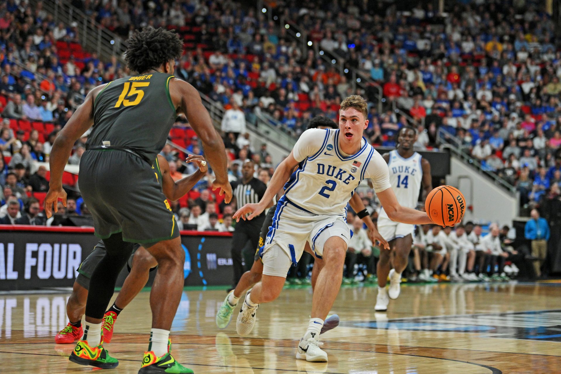 Duke Blue Devils forward Cooper Flagg (2) controls the ball as Baylor Bears forward Norchad Omier (15) defends during the second half in the second round of the NCAA Tournament at Lenovo Center.