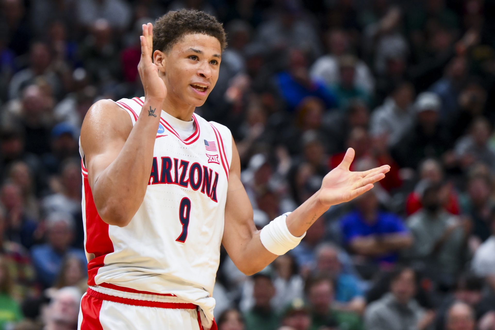 Arizona Wildcats forward Carter Bryant (9) reacts against the Oregon Ducks in the first half at Climate Pledge Arena.