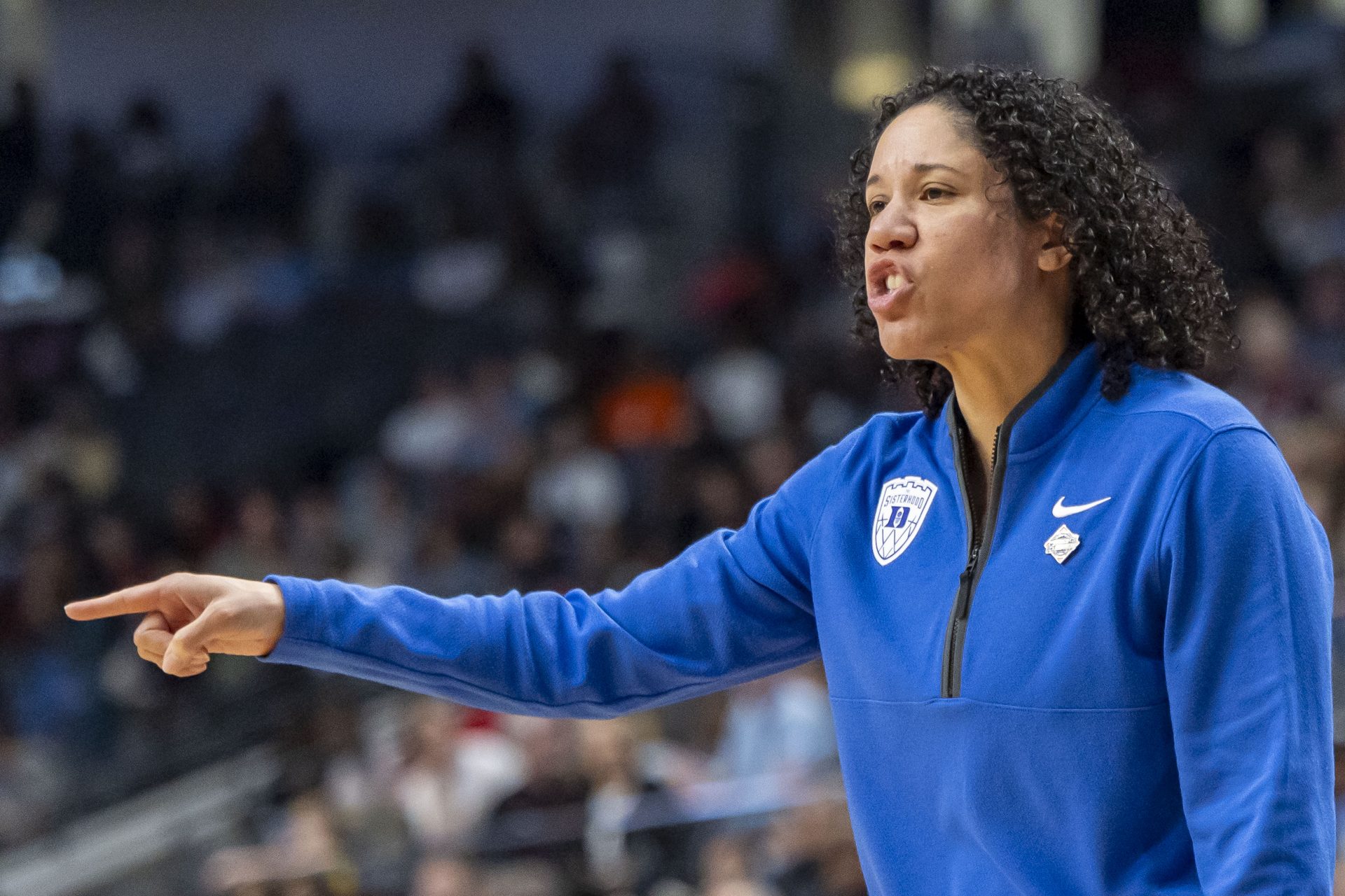 Duke Blue Devils head coach Kara Lawson coaches her team during the Sweet 16 NCAA Tournament basketball game against the North Carolina Tar Heels at Legacy Arena.