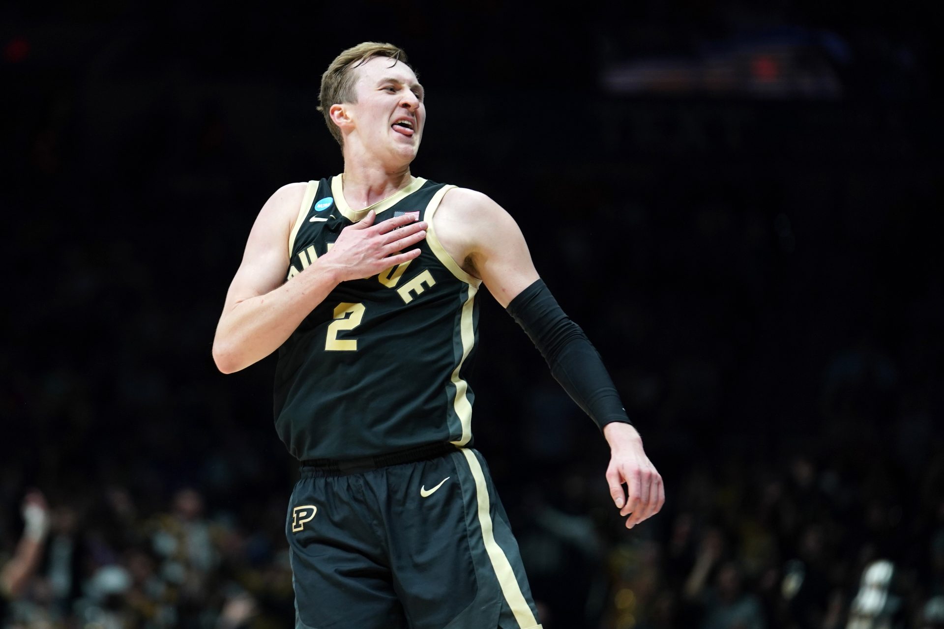 Purdue Boilermakers guard Fletcher Loyer (2) reacts against the Houston Cougars in the first half during a Midwest Regional semifinal of the 2025 NCAA tournament at Lucas Oil Stadium.