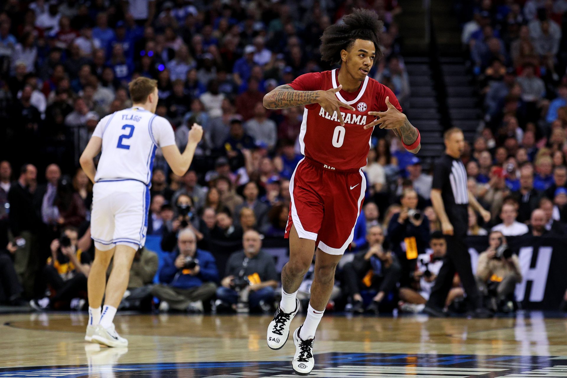 Alabama Crimson Tide guard Labaron Philon (0) celebrates after a play during the first half against the Duke Blue Devils in the East Regional final of the 2025 NCAA tournament at Prudential Center.