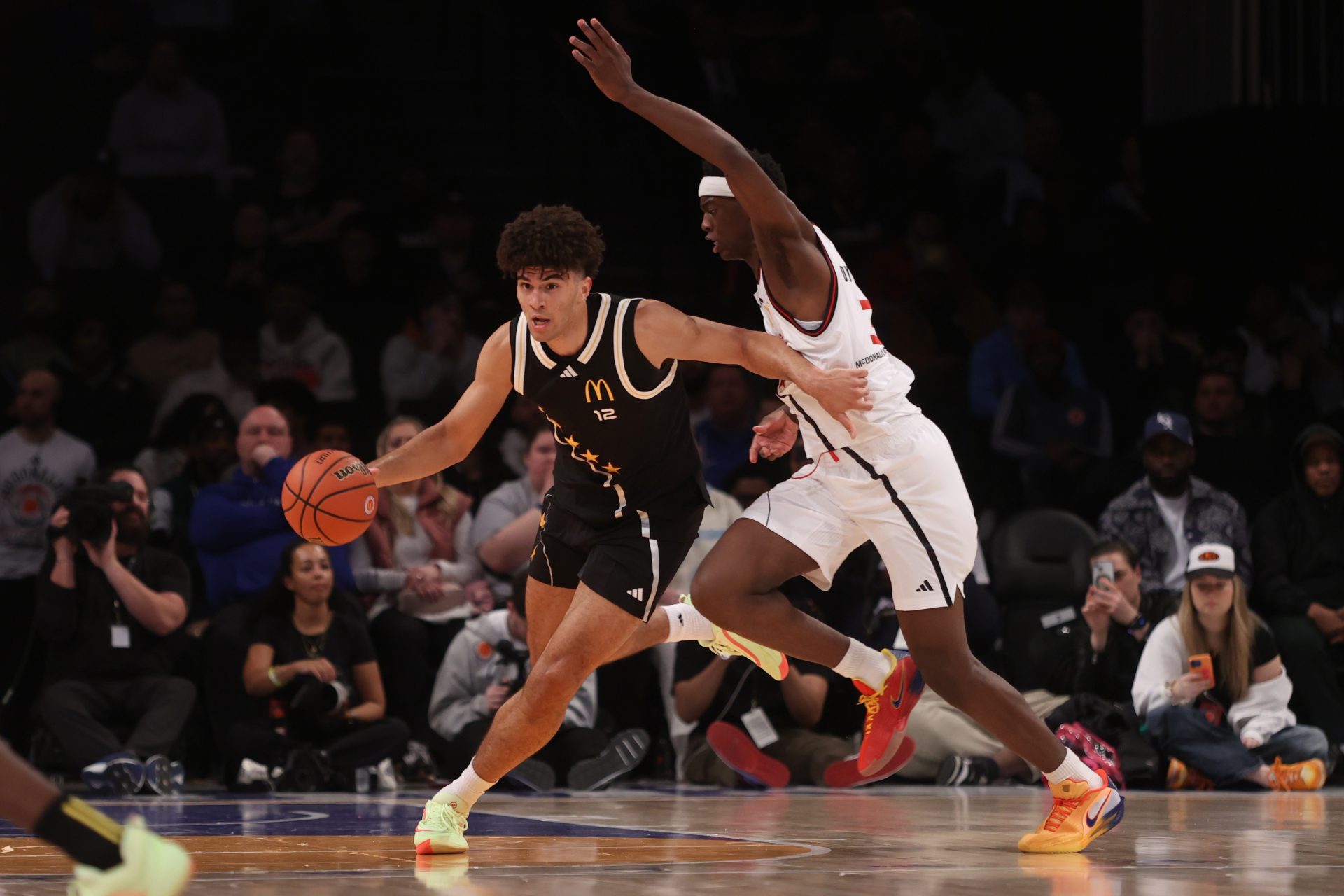 McDonald's All American East forward Cameron Boozer (12) dribbles the ball against McDonald's All American West forward AJ Dybantsa (3) during the second half of the game at Barclays Center.