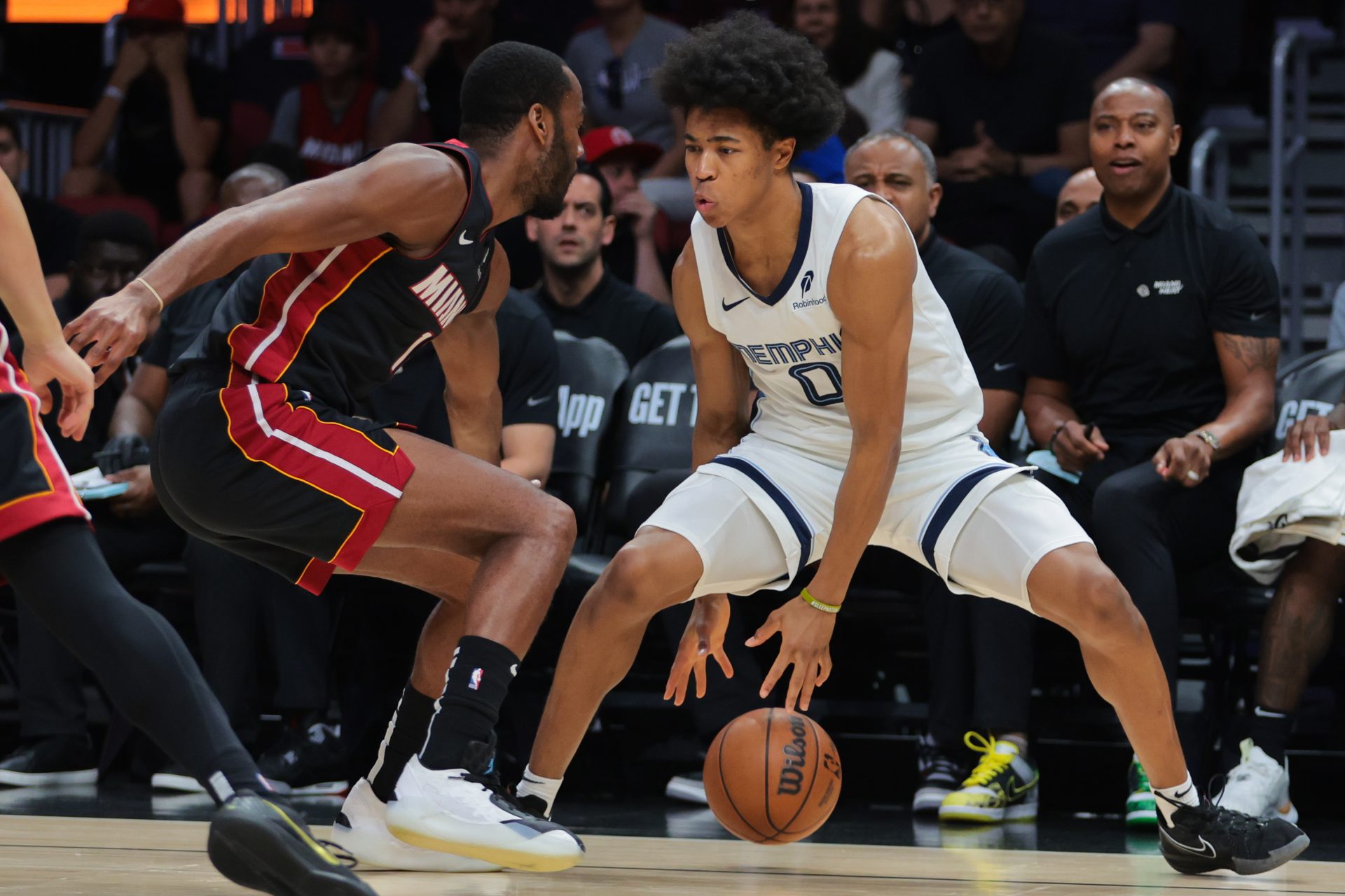 Memphis Grizzlies forward Jaylen Wells (0) dribbles the basketball as Miami Heat guard Alec Burks (18) defends during the first quarter at Kaseya Center.