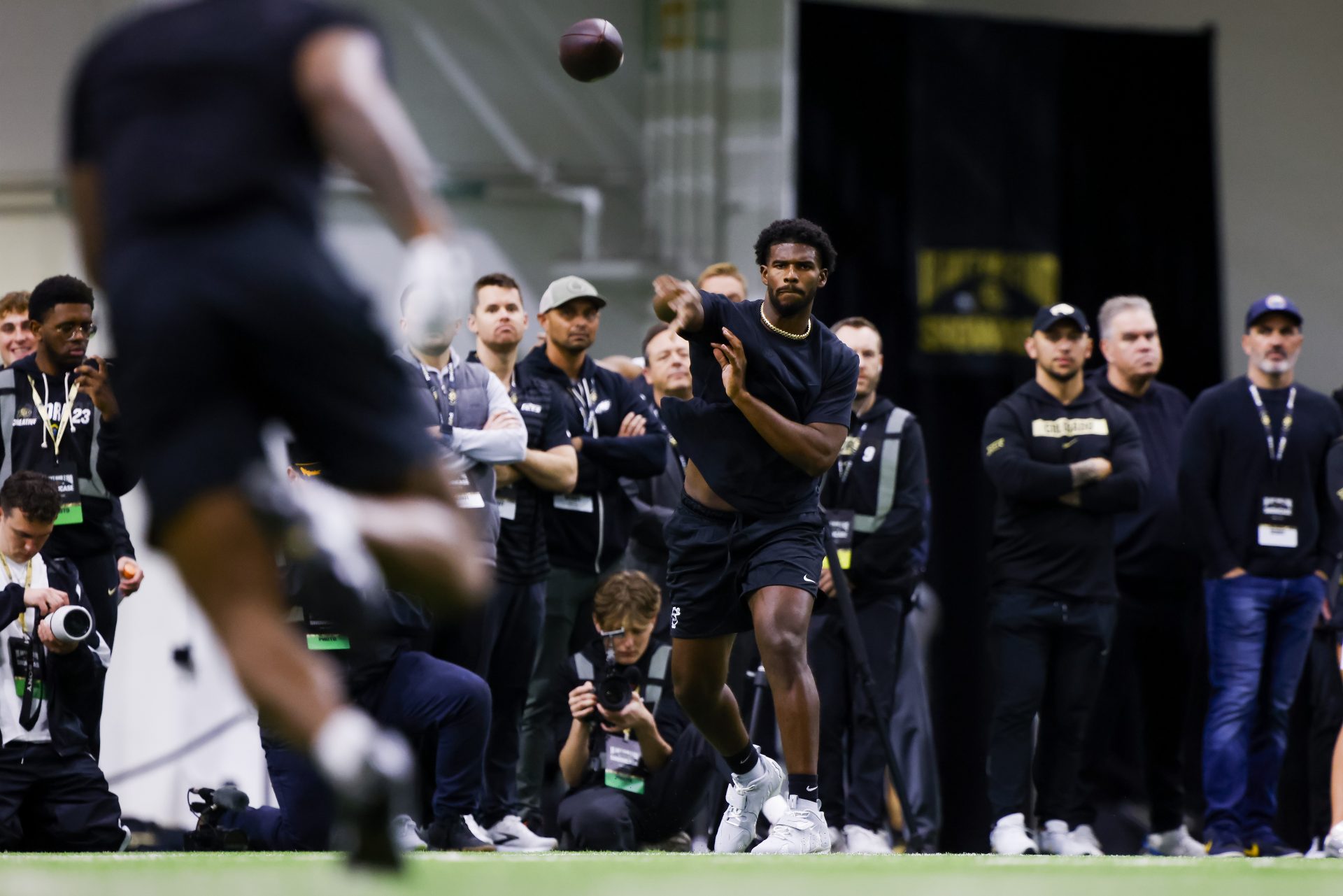 Colorado Buffaloes quarterback Shedeur Sanders (2) passes the ball at the University of Colorado NFL Showcase at the CU Indoor Practice Facility.